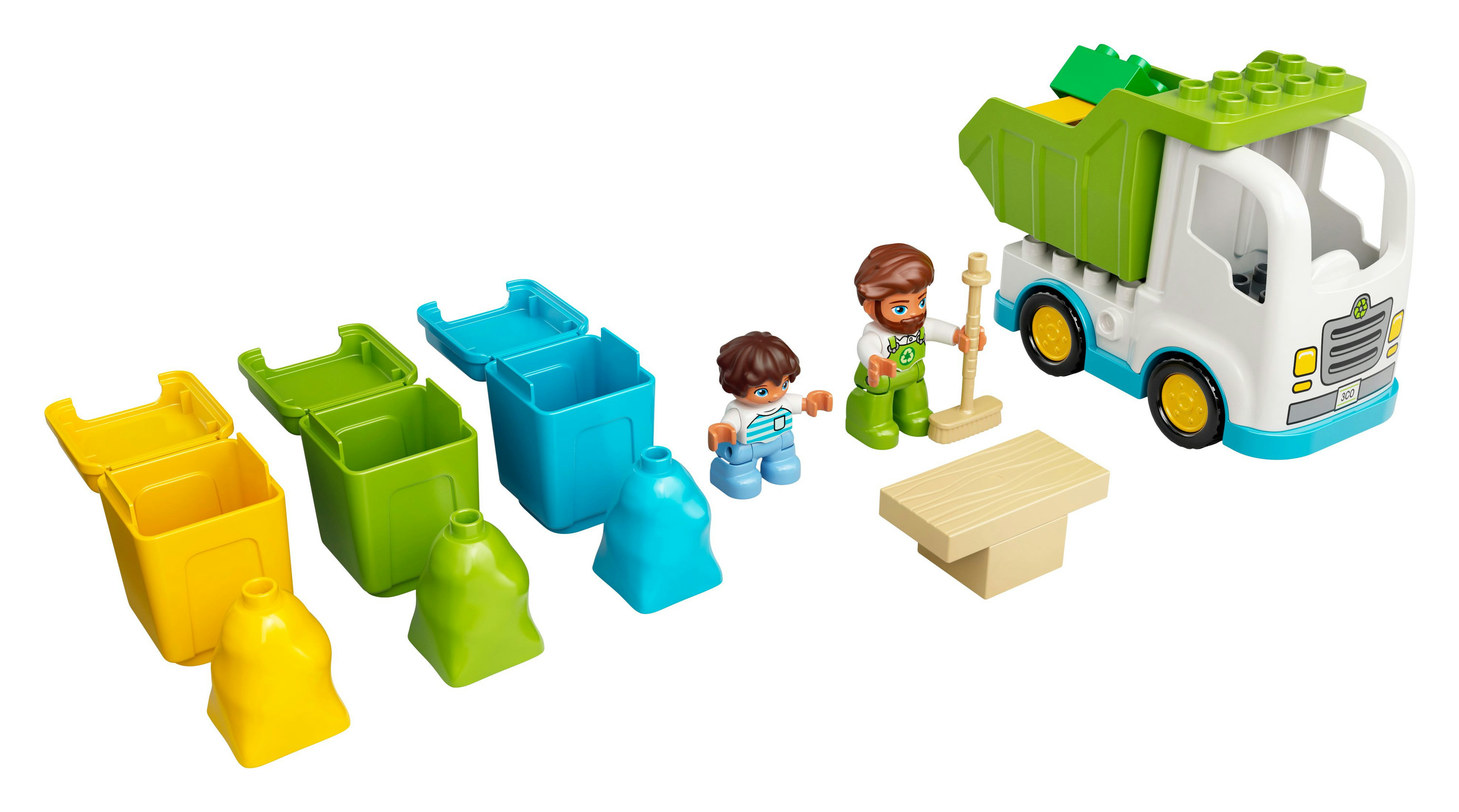 Un camión de basura de Lego y un conjunto de botes con dos figuras y una mesa.