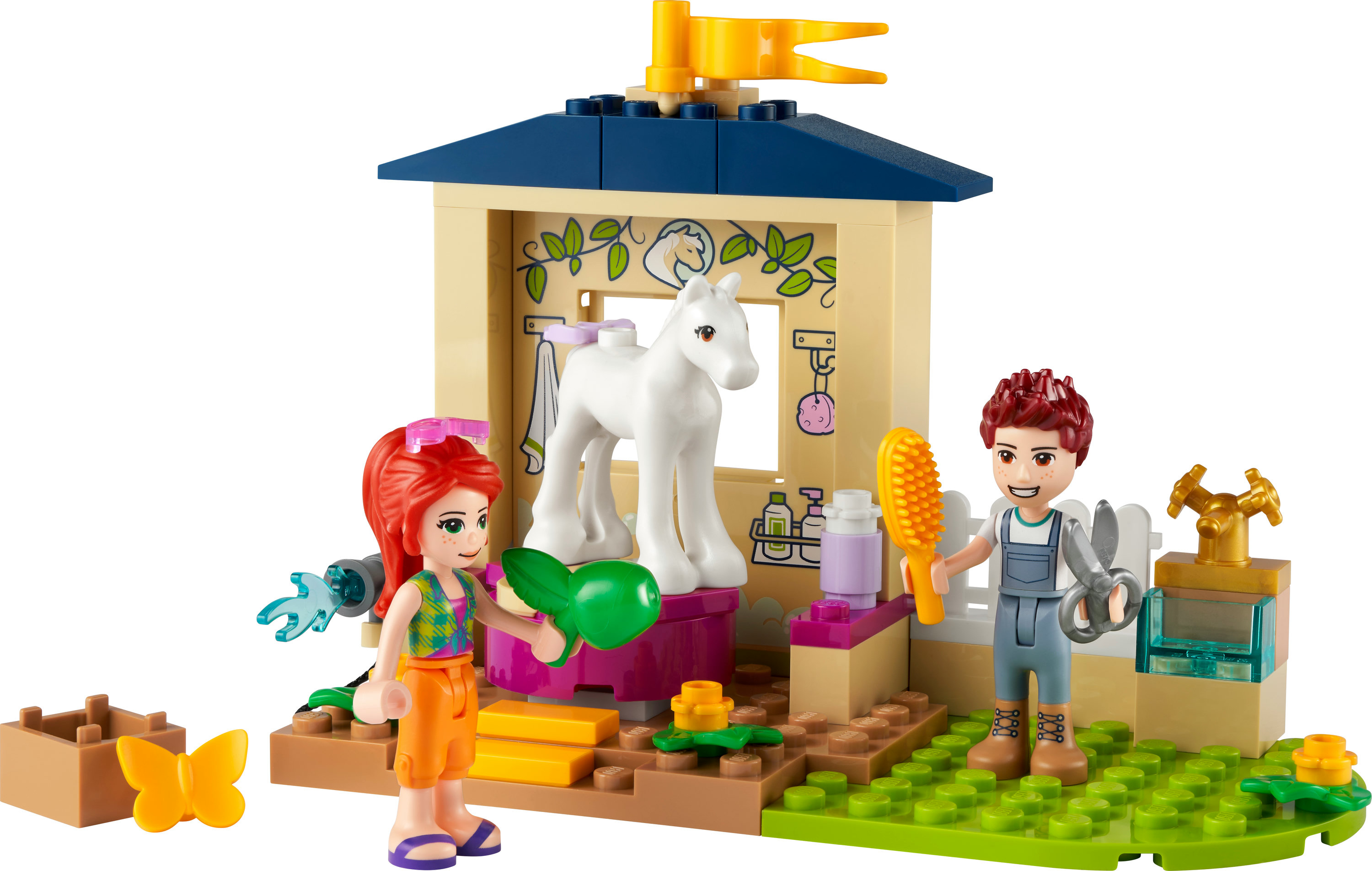Lego Friends set met een paardenstal, twee figuren, een wit paard en verzorgingsaccessoires.