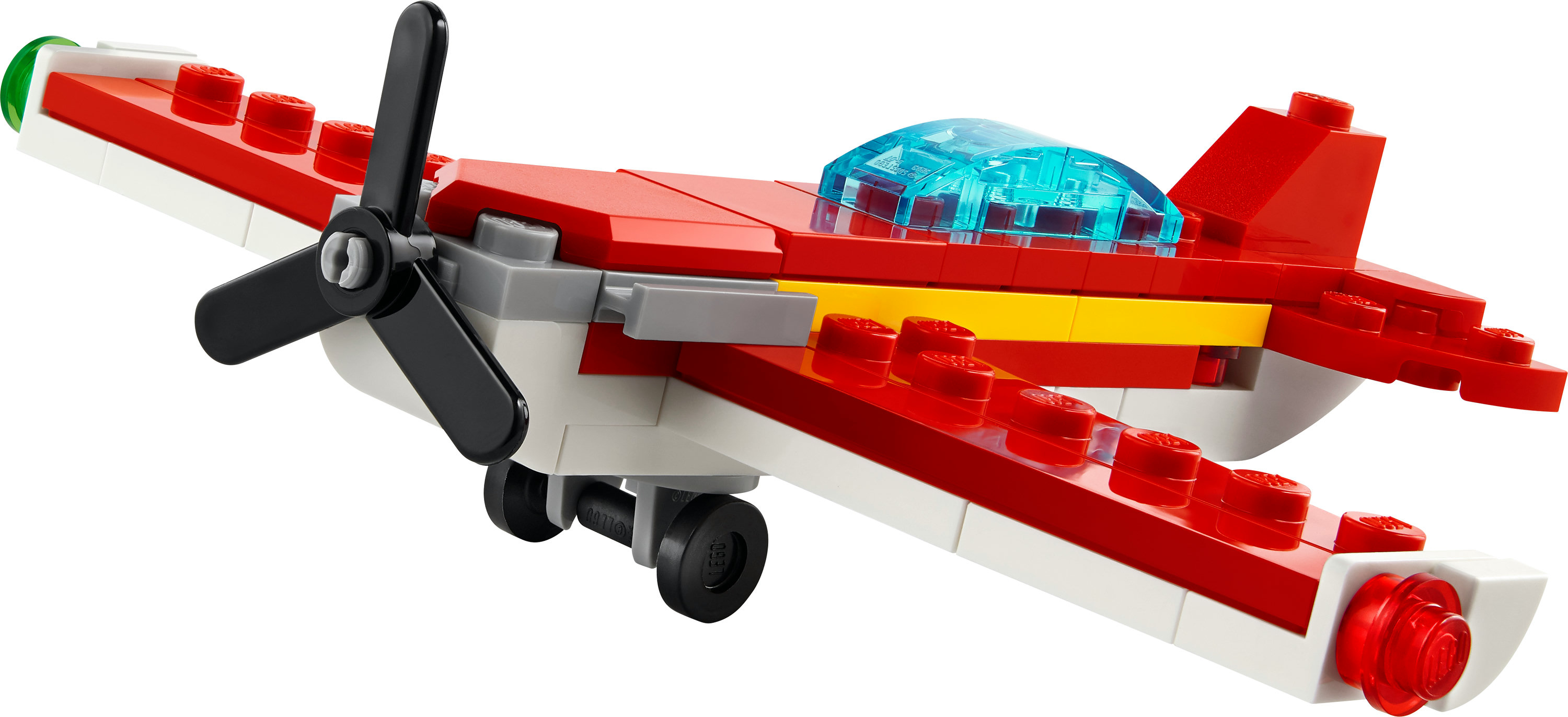 Pervaneli ve şeffaf kokpitli kırmızı ve beyaz Lego uçağı.
