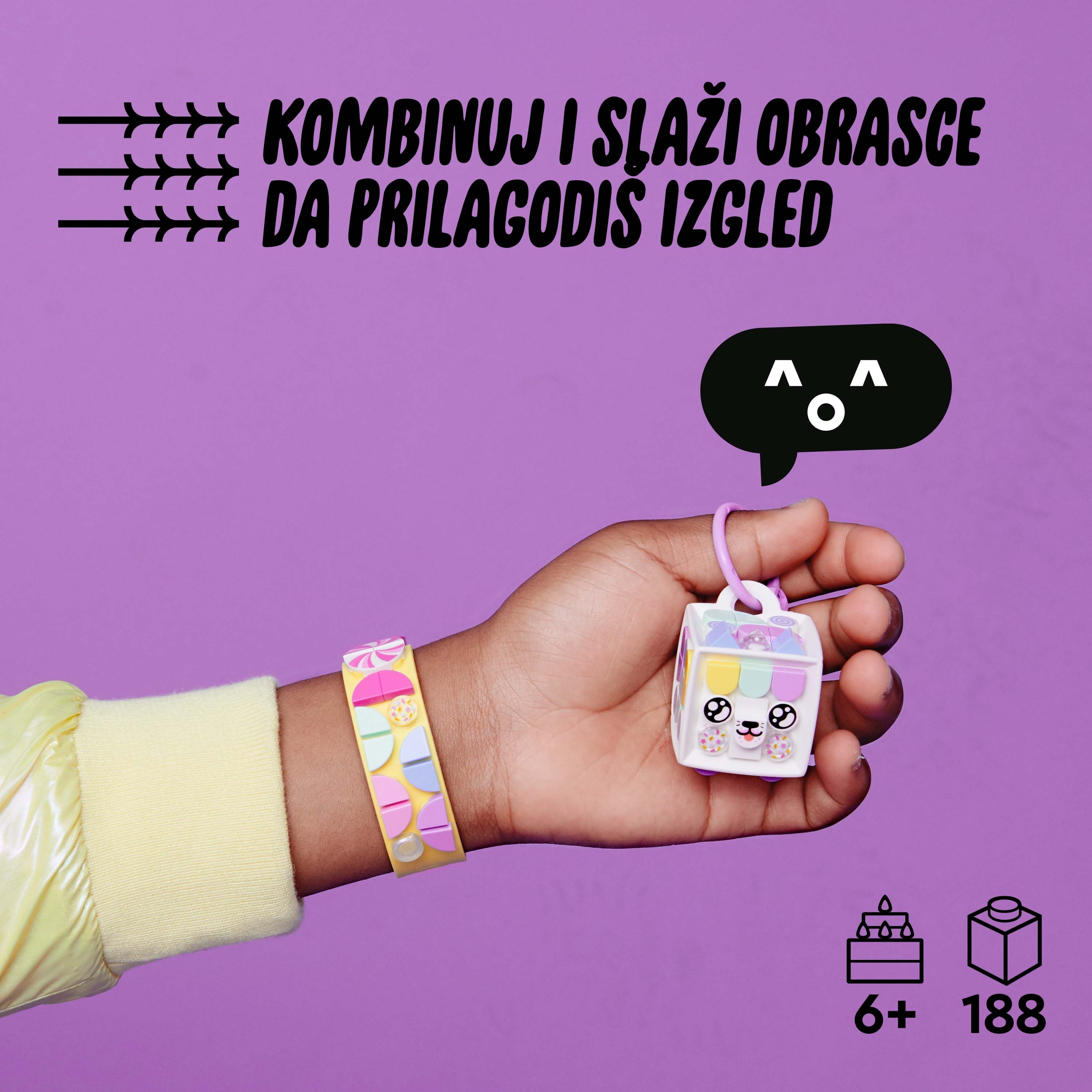 Eine Hand hält ein Lego-Set mit einem Armband. Das Set beinhaltet einen Würfel, der Text ist in einer Sprechblase.
