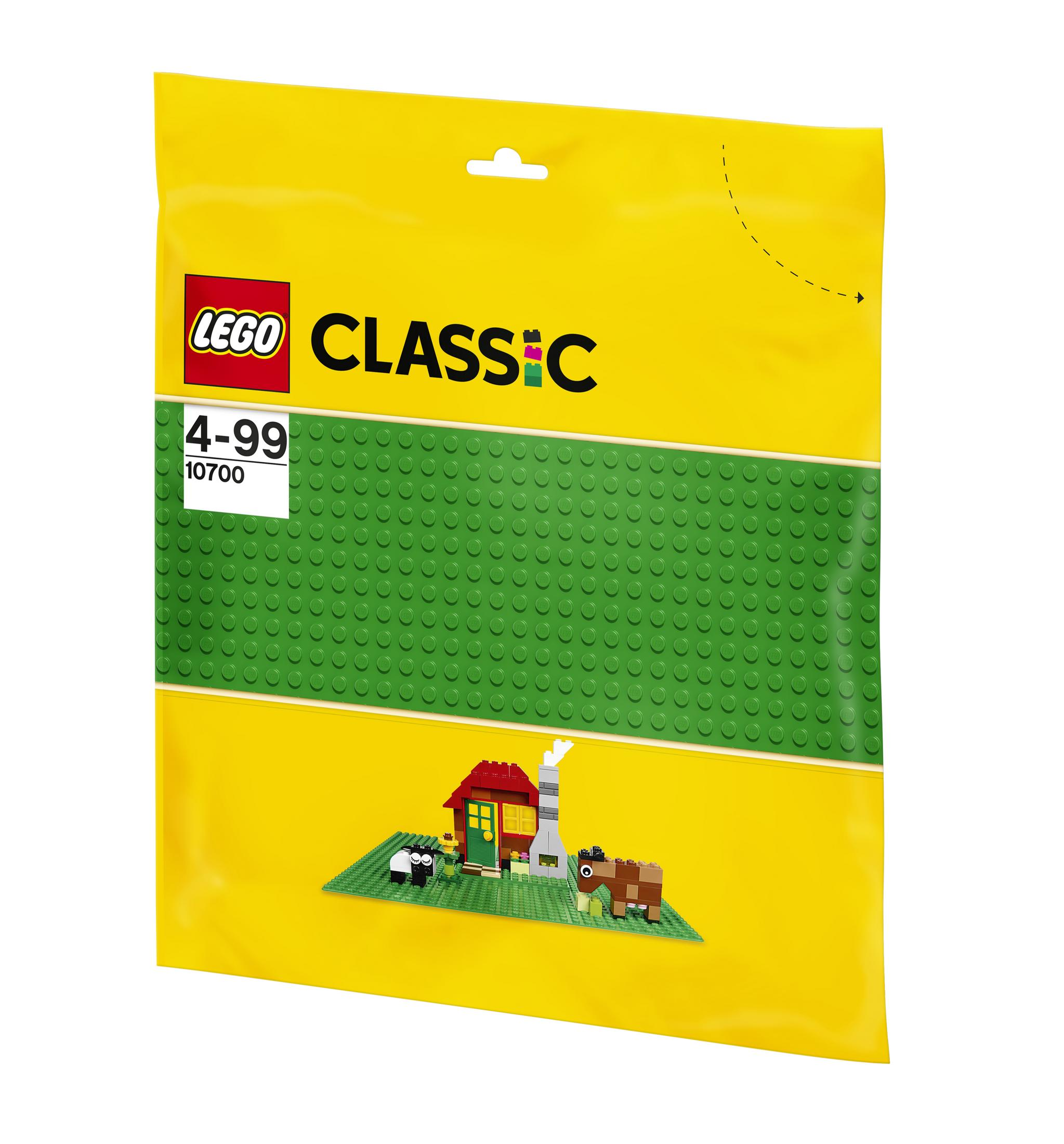 Lego Classic Set in gelber Tüte. Die Tüte hat eine grüne Grundplatte und eine kleine Hausszene.