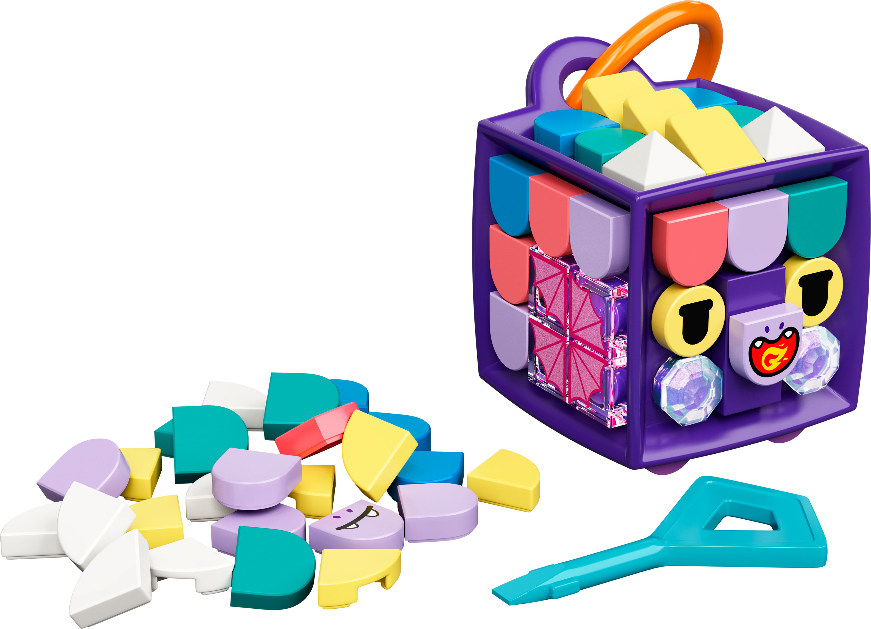 Scatola viola con forme colorate e manico. Alcune forme sparse, più una chiave.