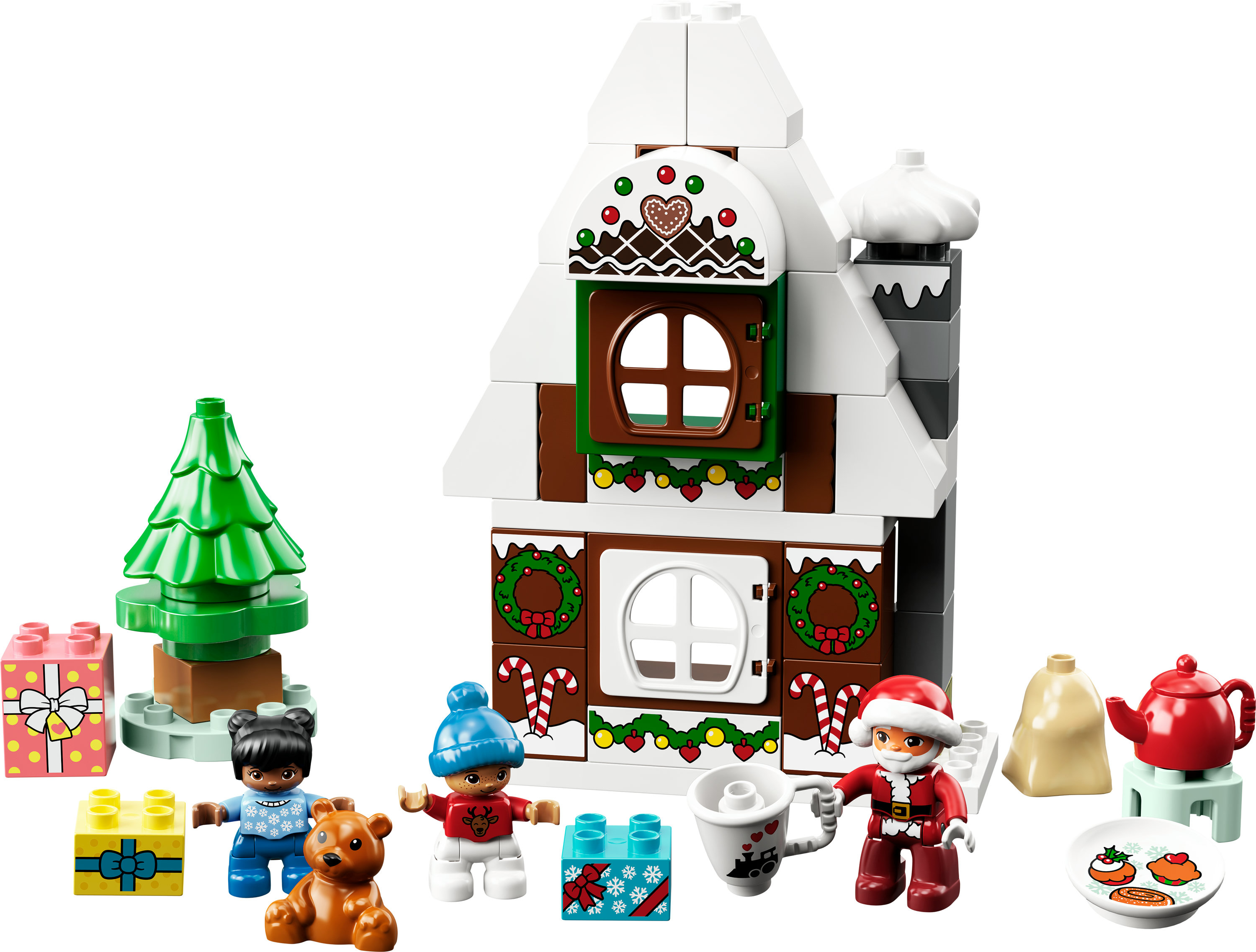 Una casa de jengibre LEGO Duplo con minifiguras, regalos, un árbol de Navidad y otros elementos festivos.