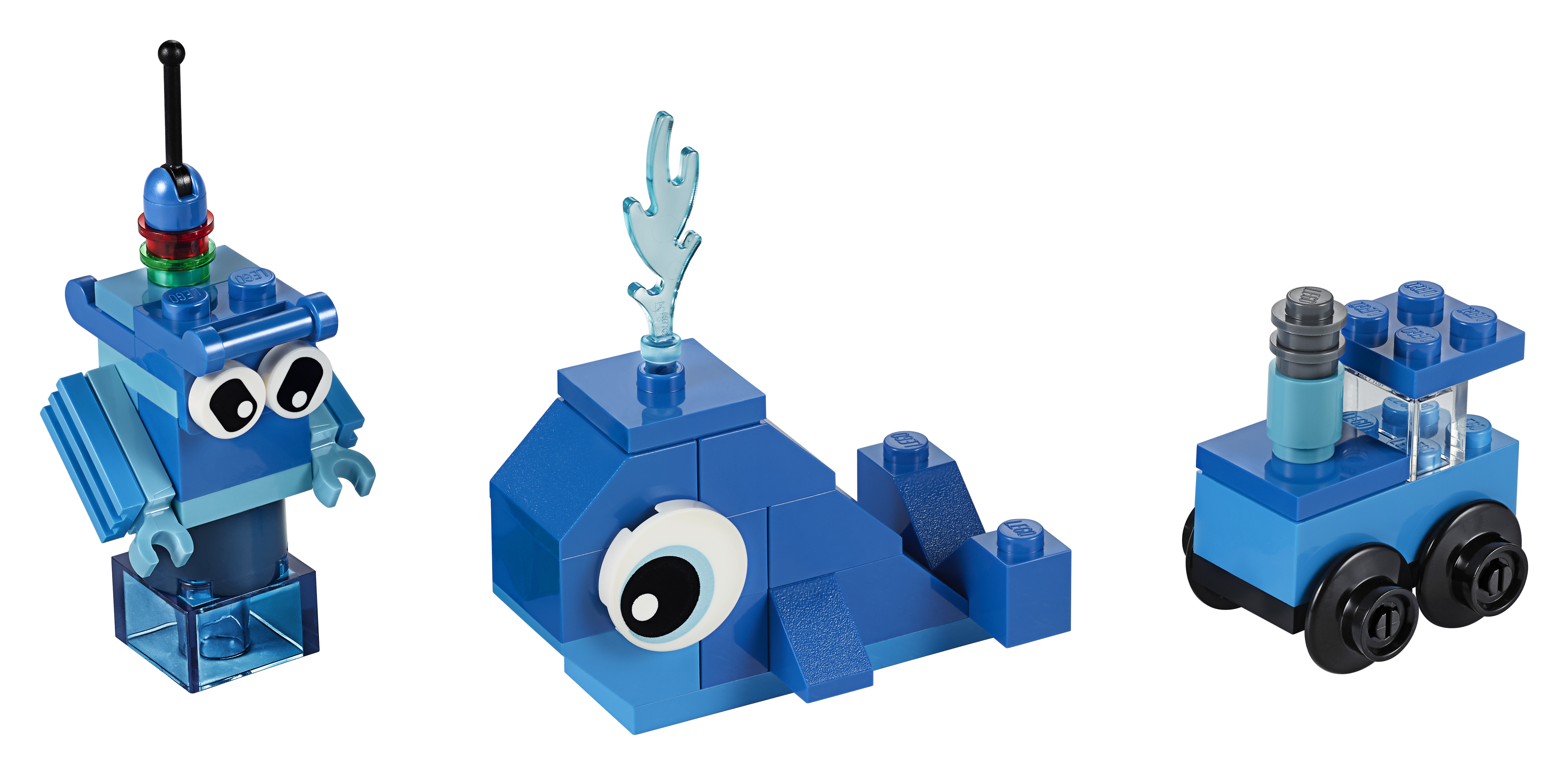 Drei blaue Lego-Figuren: Roboter, Wal und Auto.