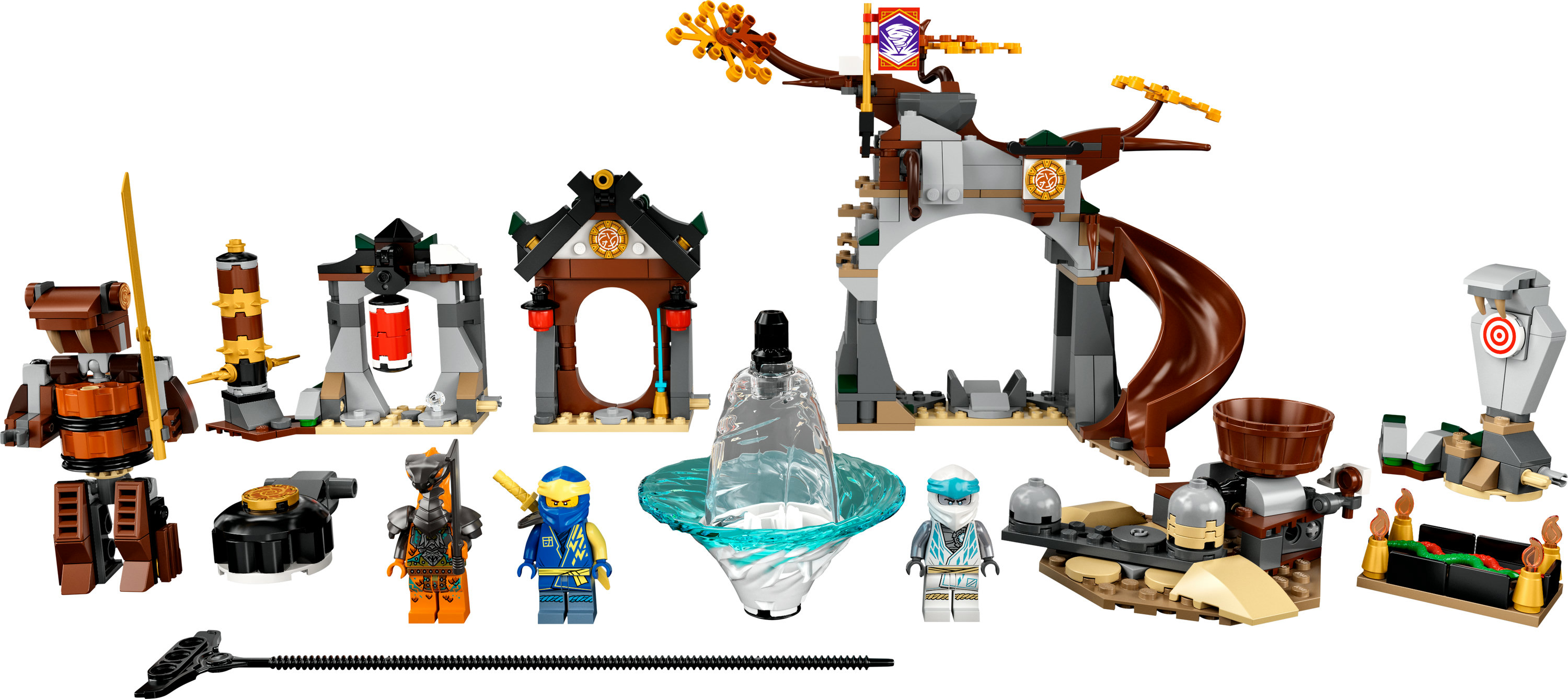 LEGO Ninjago set, with various structures, figures, and weapons laid out.