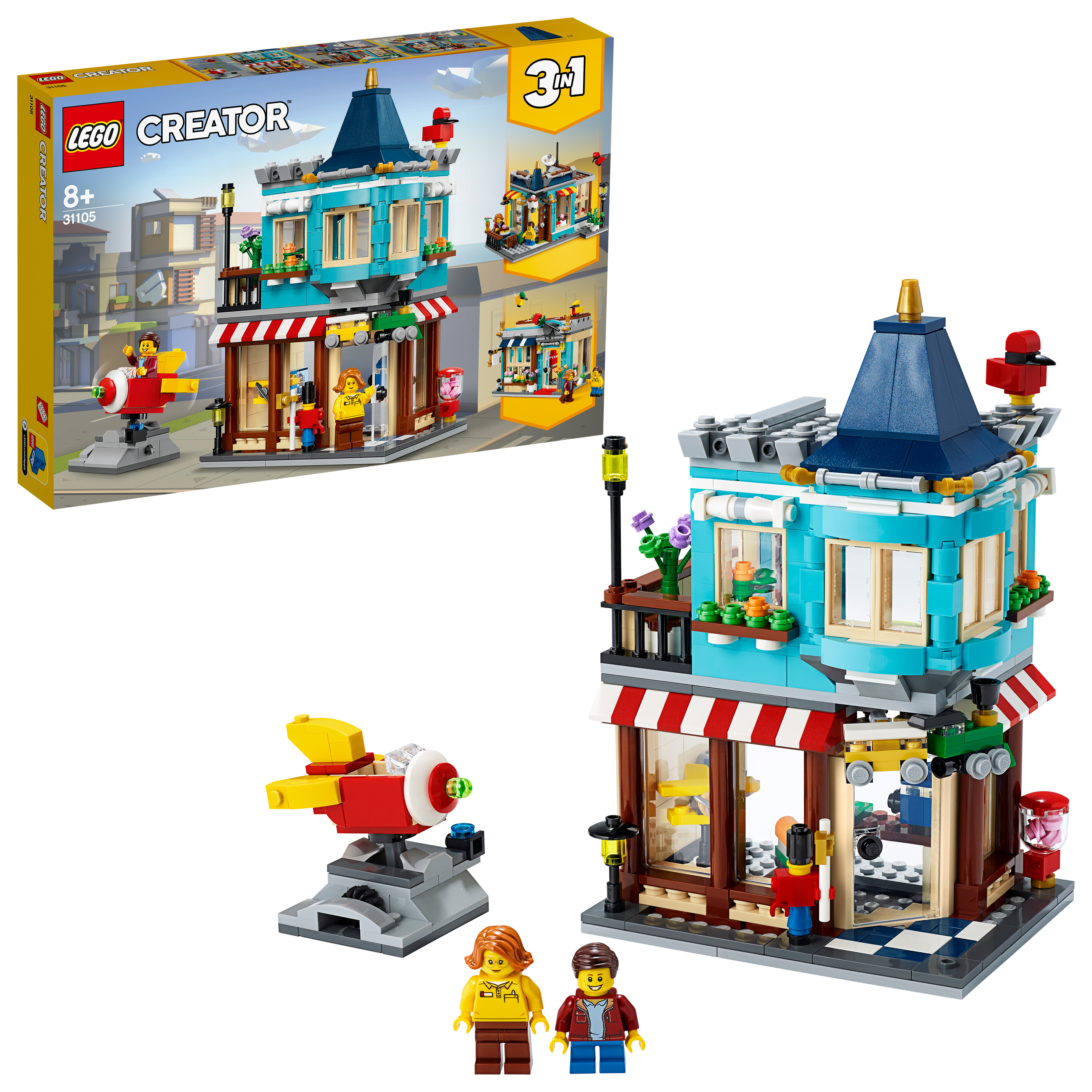 LEGO Creator Set: Ein blaues Gebäude mit roter Markise, Figuren und eine gelbe Box mit dem Set.