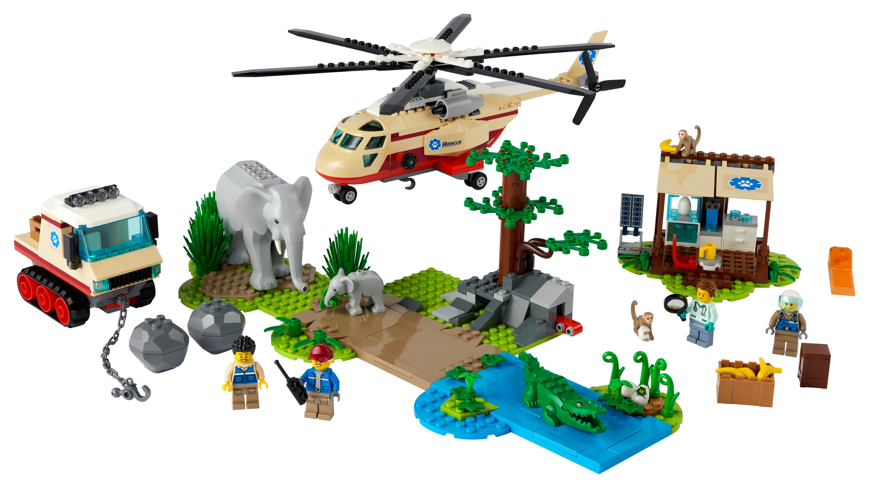Zestaw LEGO z helikopterem, słoniem, krokodylem i minifigurkami, przedstawiający scenę ratowania dzikiej przyrody.