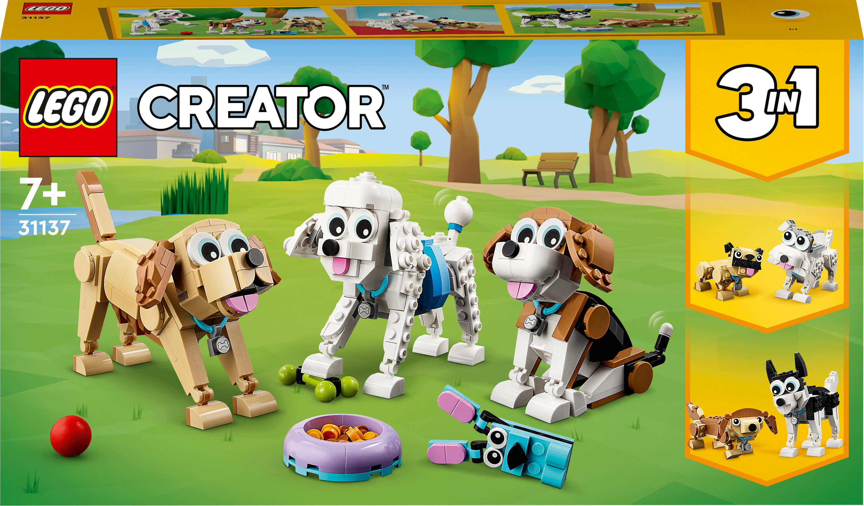 Een LEGO Creator set met drie hondenmodellen: een beagle, een poedel en een bruine hond, op gras.