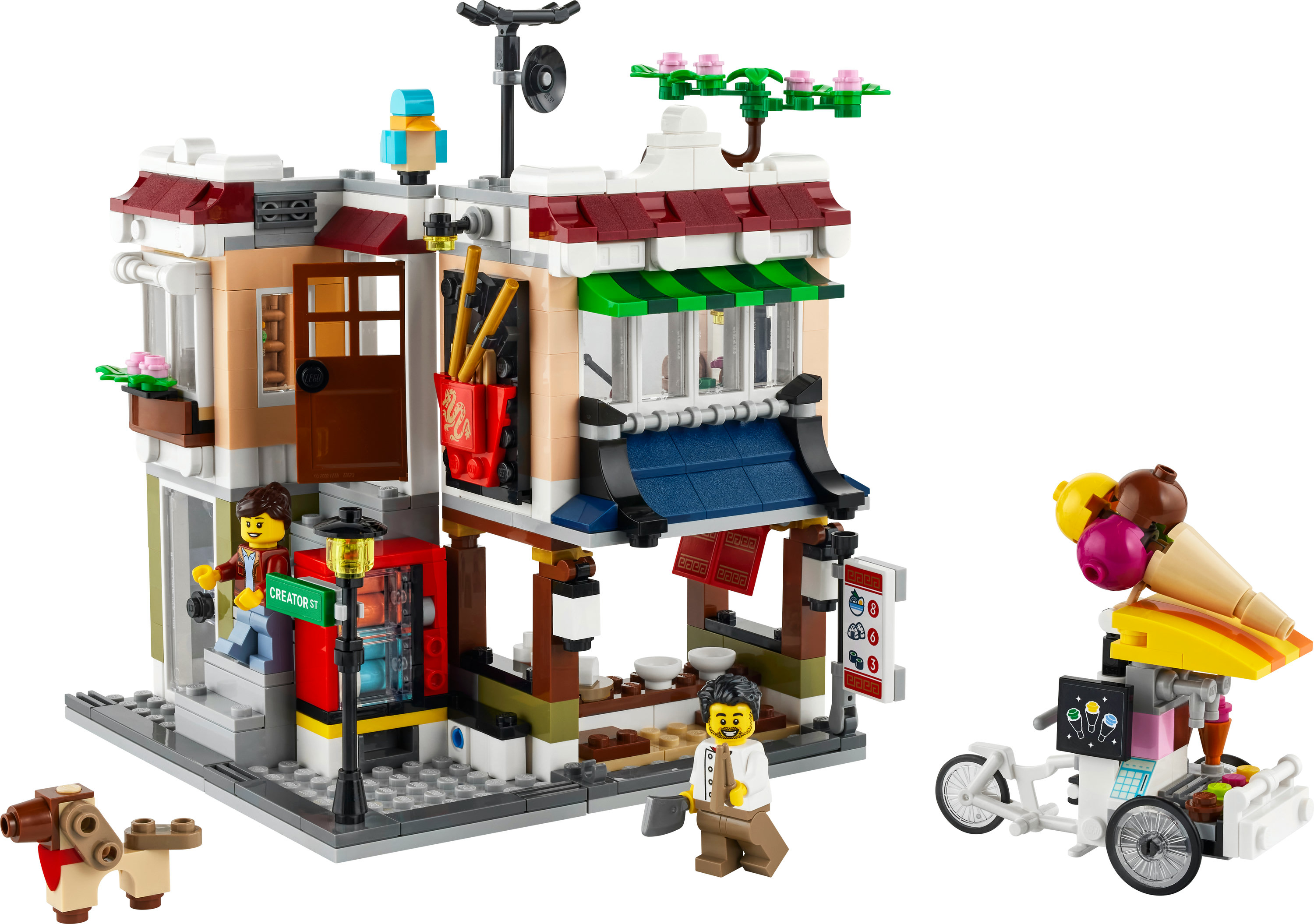 Lego Creator Set eines Gebäudes mit Eiswagen und Minifiguren.