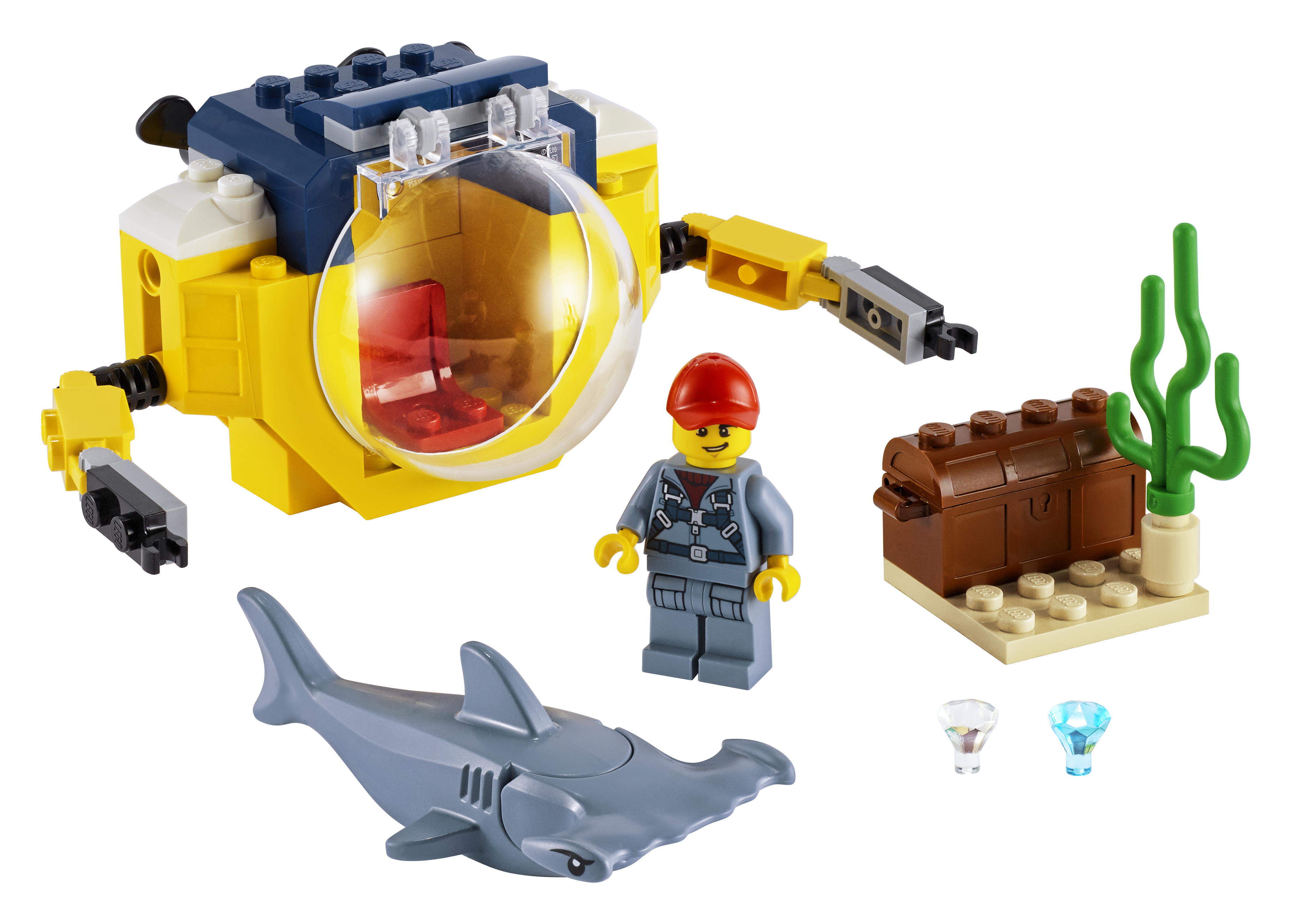 Lego-Set mit einem gelben U-Boot, einem Taucher, einer Schatztruhe, einem Hai und Edelsteinen.