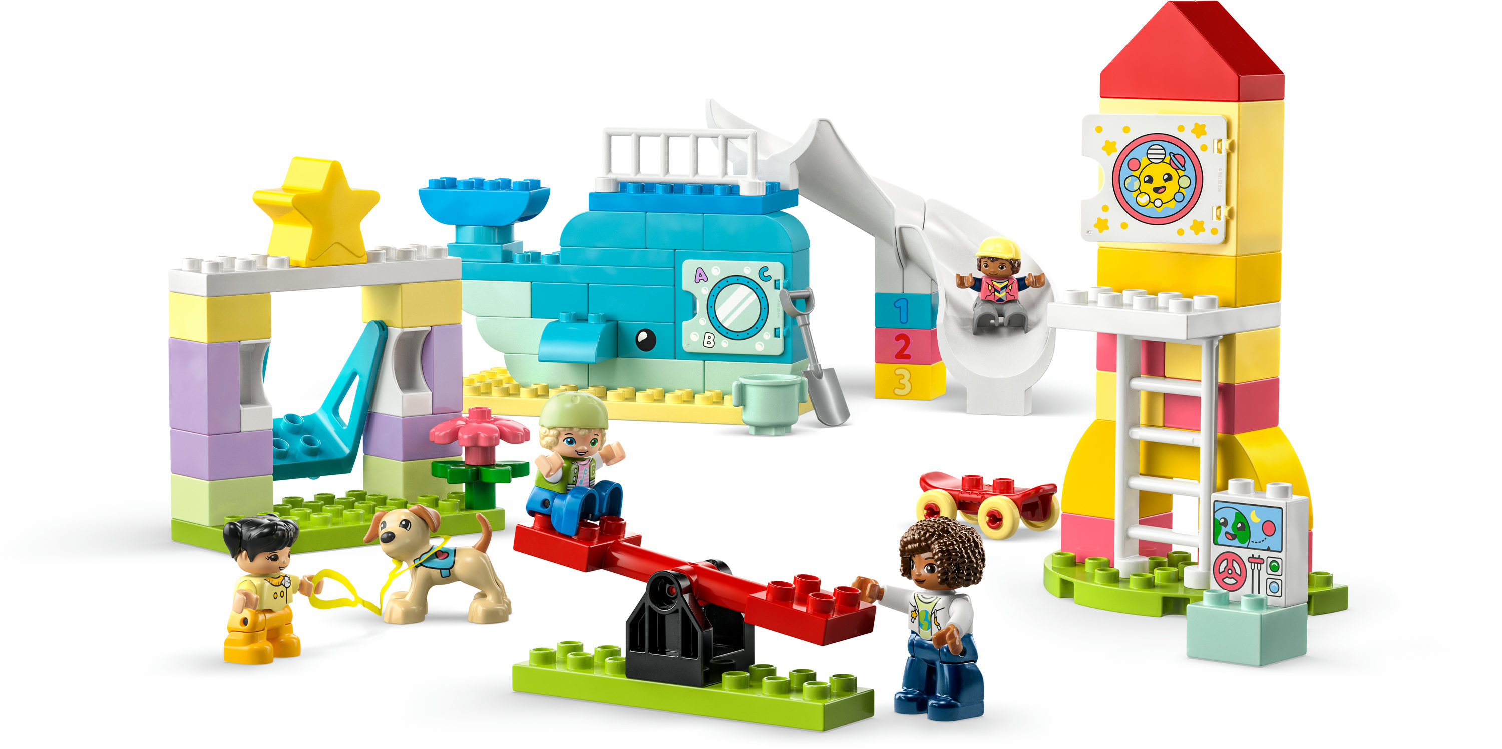 LEGO Duplo Spielset mit Figuren, einer Walrutsche, einem Raketenturm und anderen farbenfrohen Strukturen.