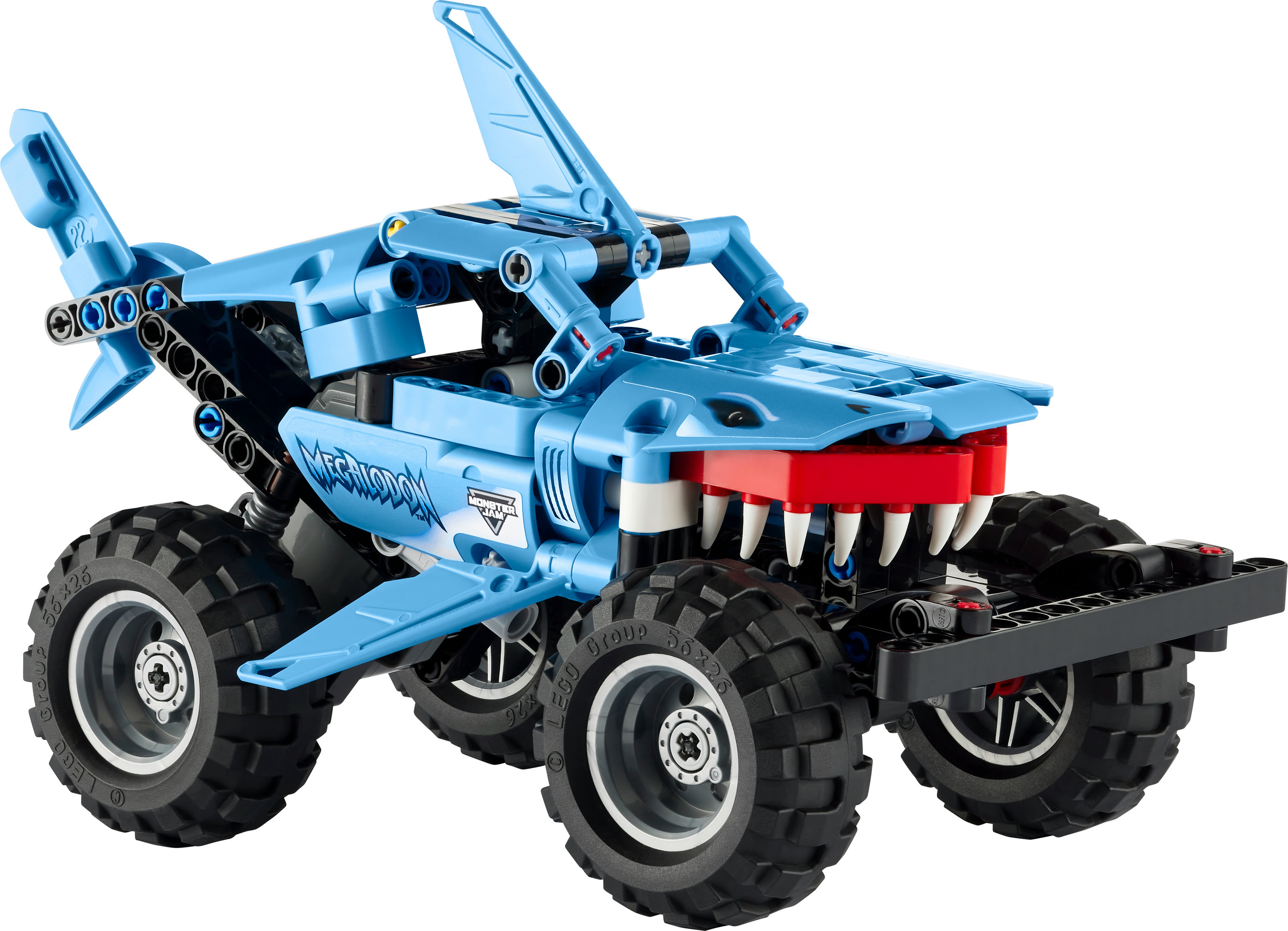 Ein blaues Lego Monster Truck mit Haiflossen und großen schwarzen Reifen.