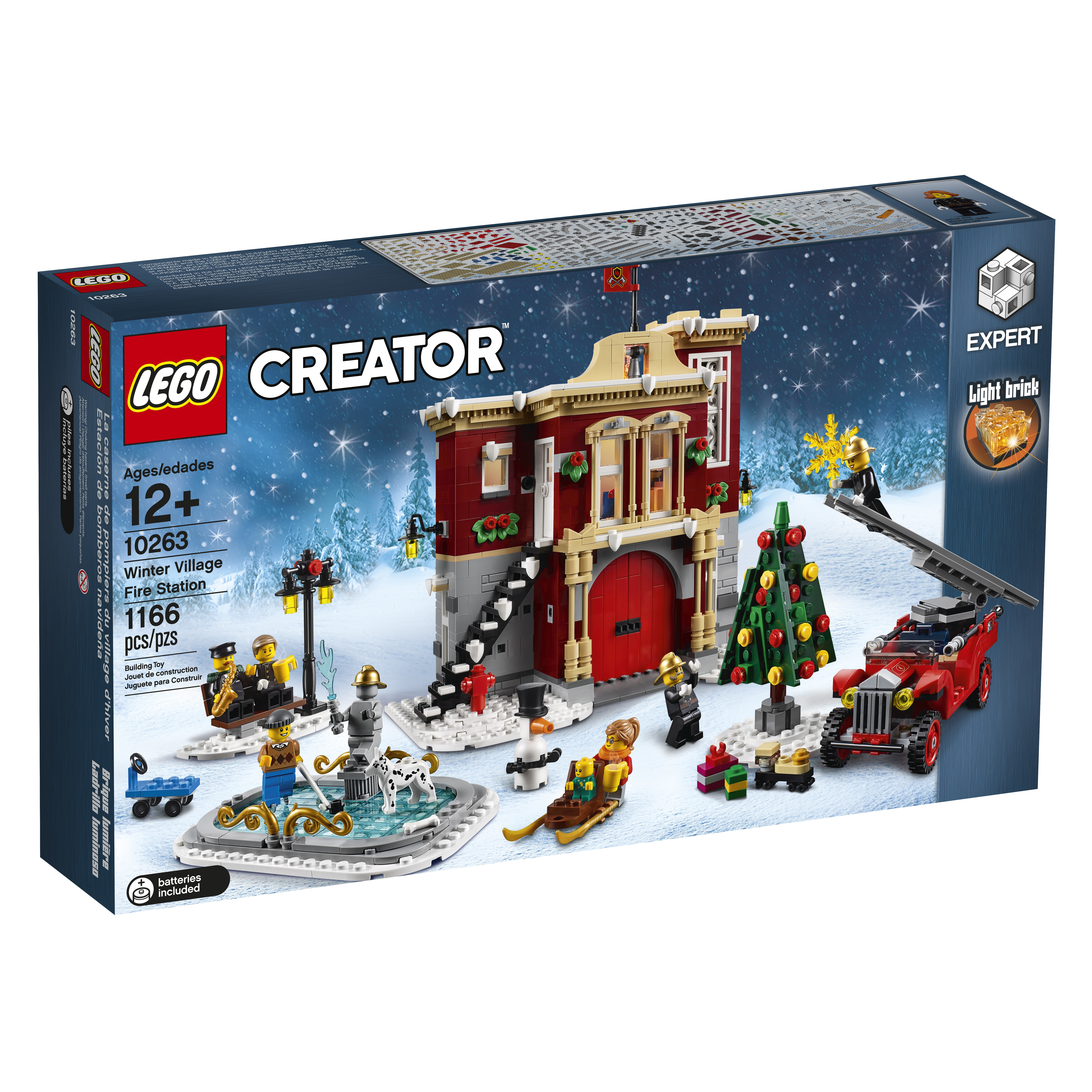 Zestaw LEGO Creator Winter Village Fire Station, ze strażą pożarną i elementami zimowej scenerii.