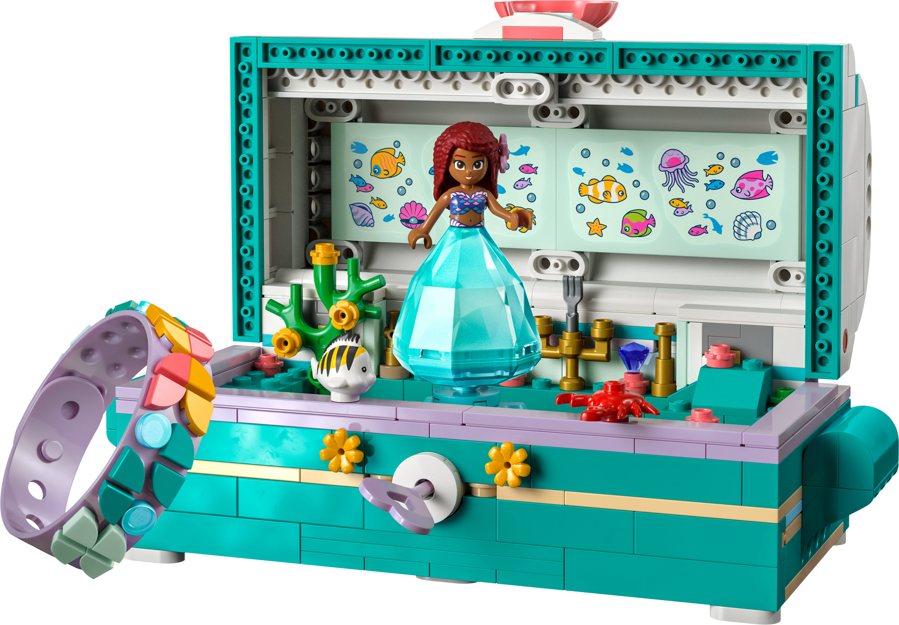 Szkatułka LEGO Disney Ariel: figurka syreny, stworzenia morskie i bransoletka. Turkusowe tło.