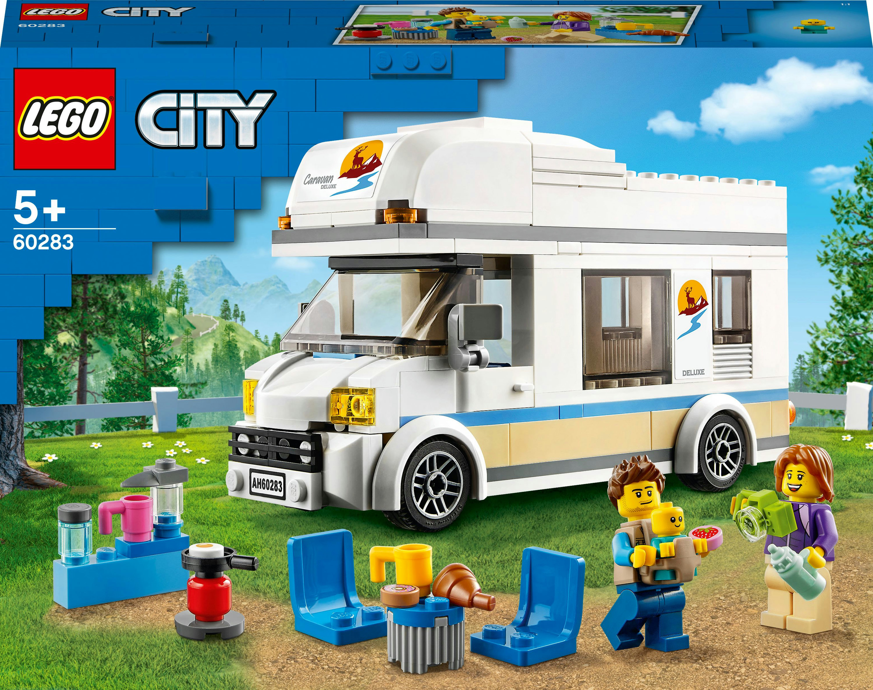 Een Lego City set toont een wit en blauw RV met een gezin en picknickartikelen voor een groen veld.