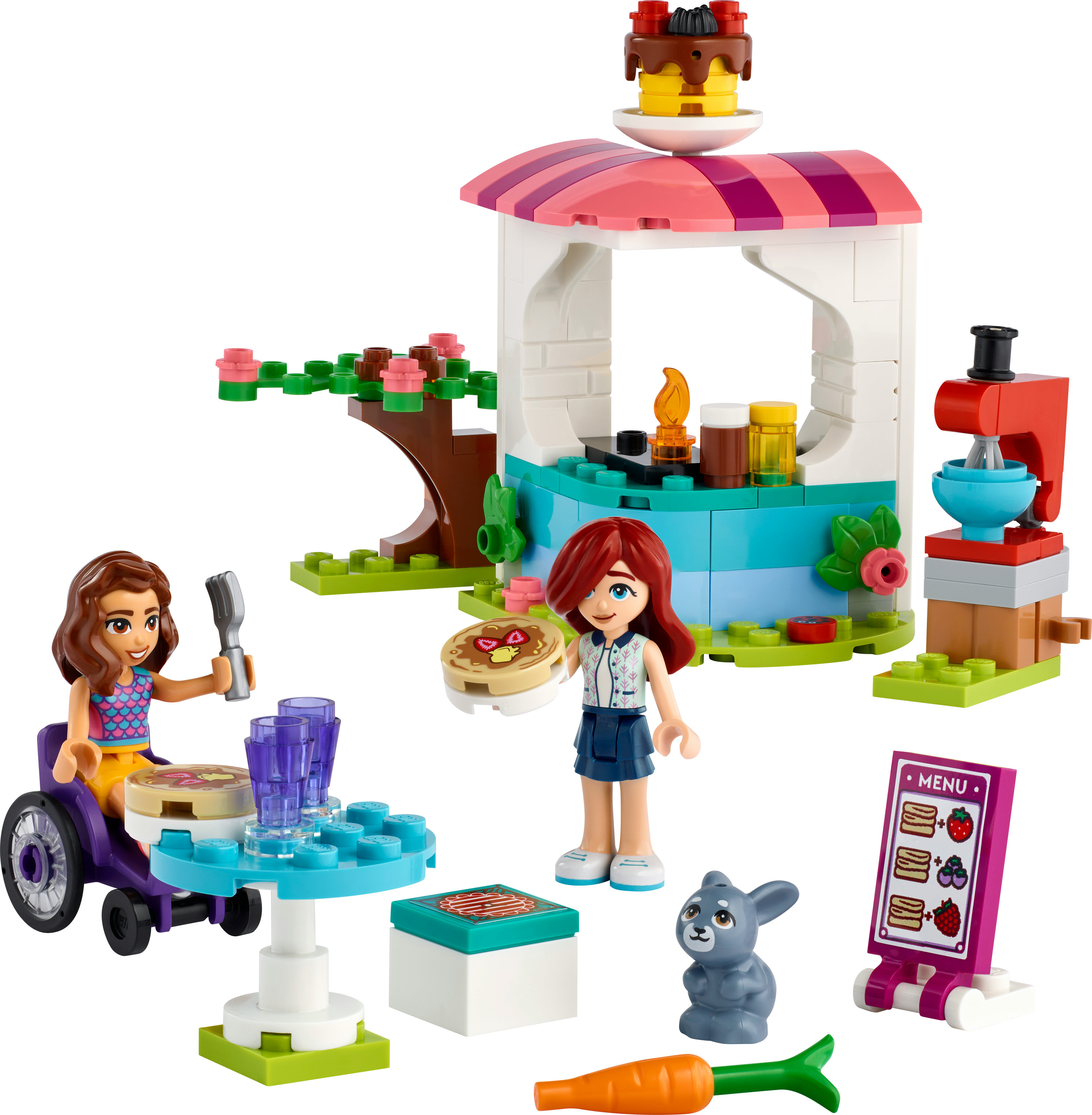 Lego Friends seti, kafe ile. Tekerlekli sandalyede figürler ve bir tavşan içerir. Masa ve pasta mevcut.