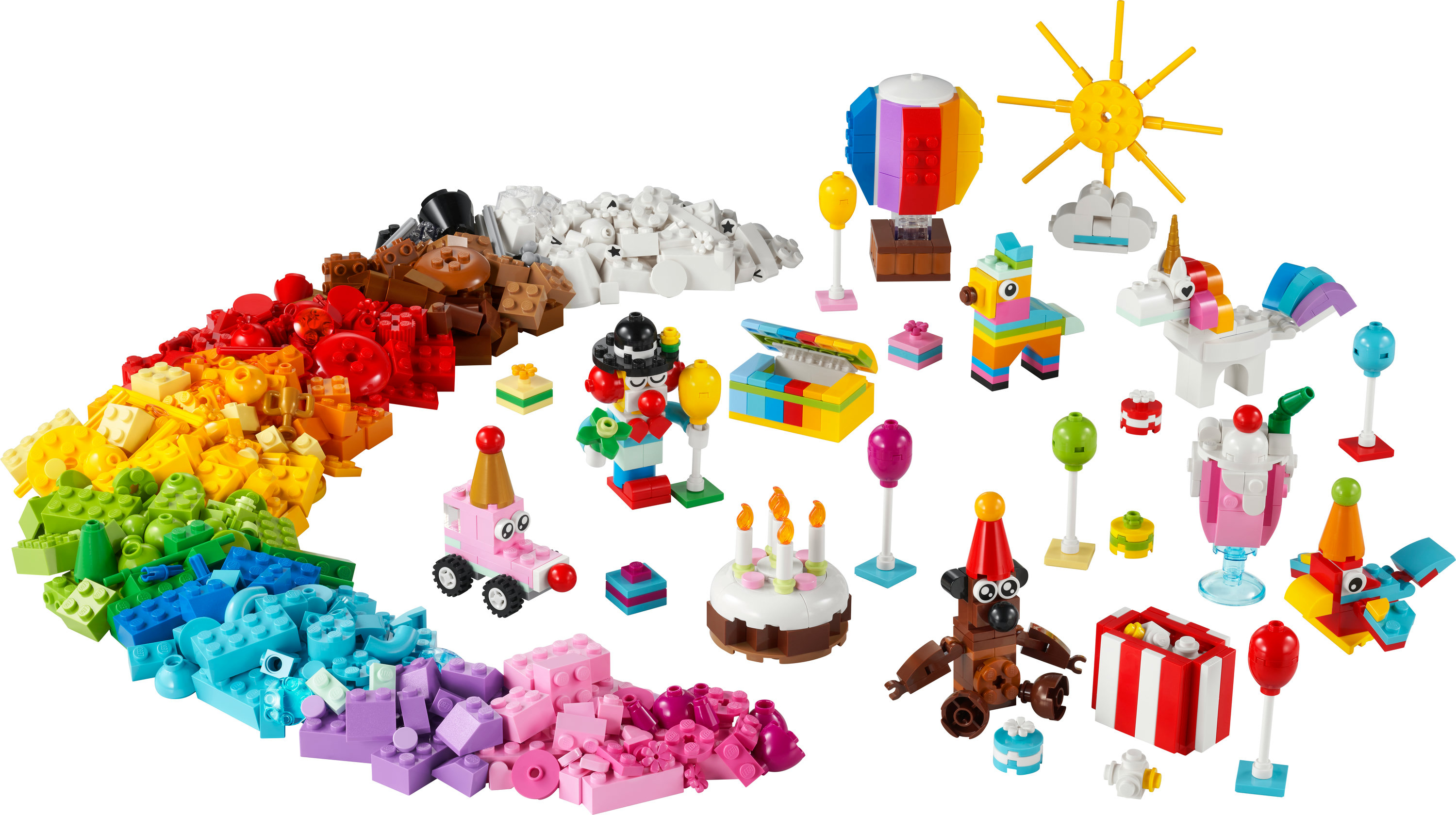 Lego-set met kleurrijke stenen en diverse modellen met een verjaardagsthema.