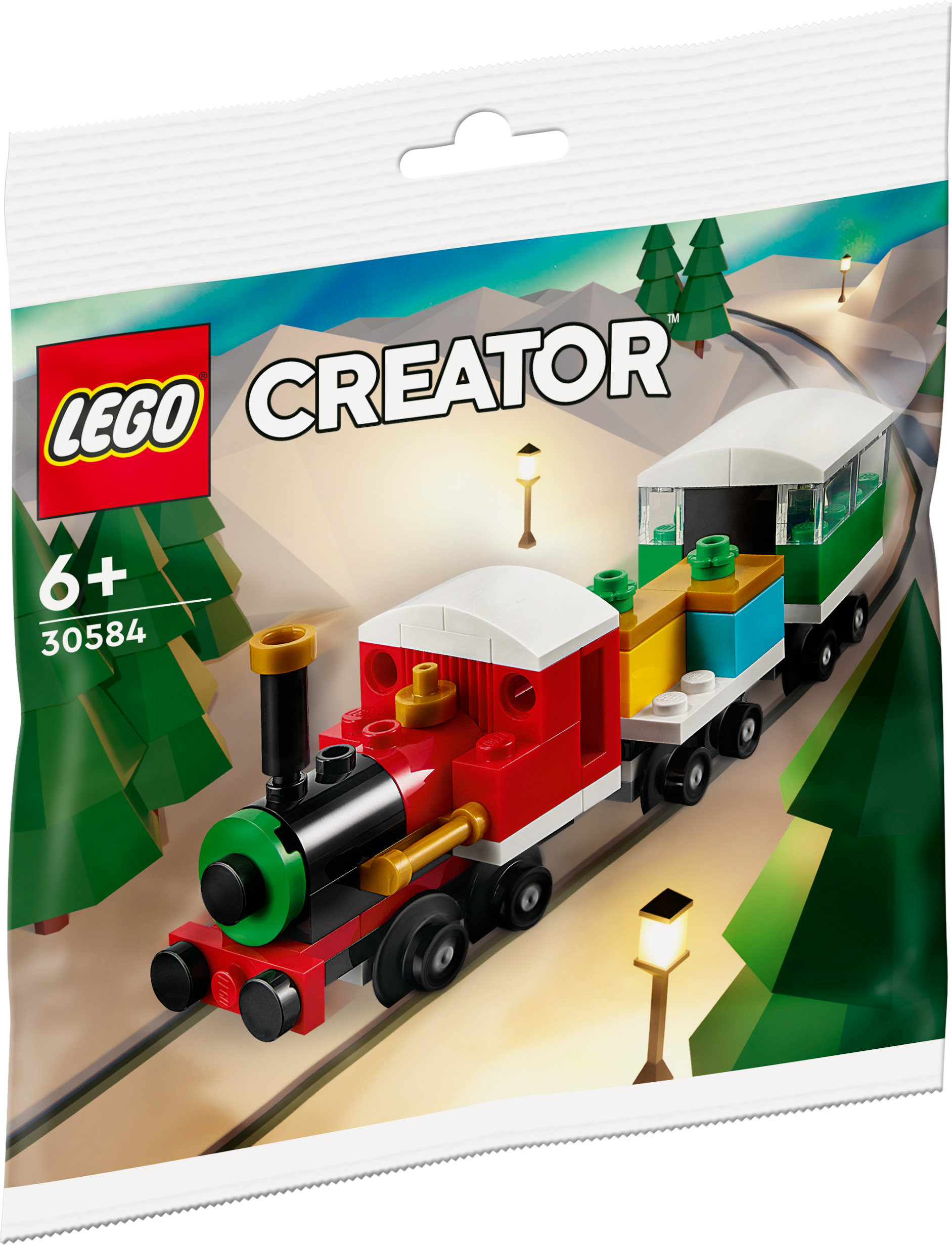 Ein LEGO Creator Zug-Set in einer Tüte, mit einem roten Zug, einem grünen Wagen und einer Winterkulisse.