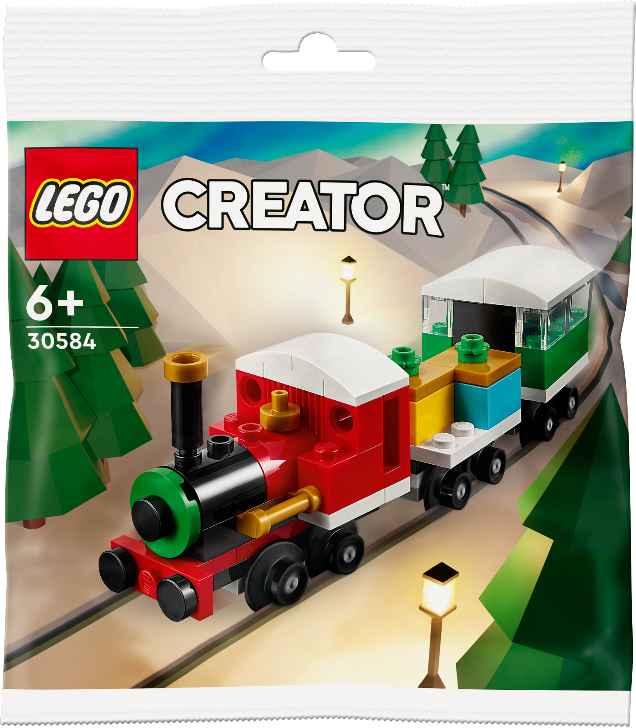 Lego Creator Zugset in einer Tüte. Roter und gelber Zug mit grünem Wagen, auf einer Strecke.