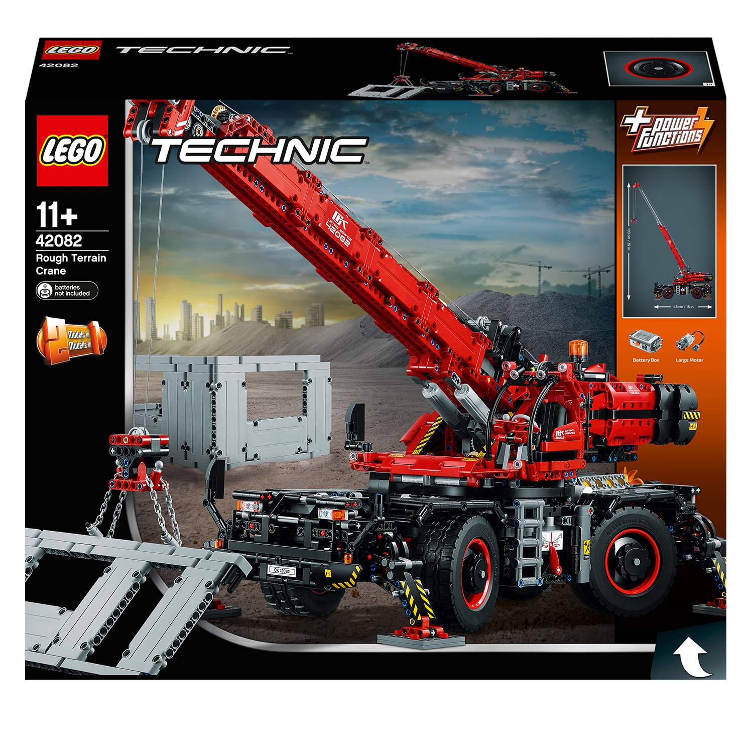 Pudełko LEGO Technic, czerwony dźwig na budowie, z miastem w tle.