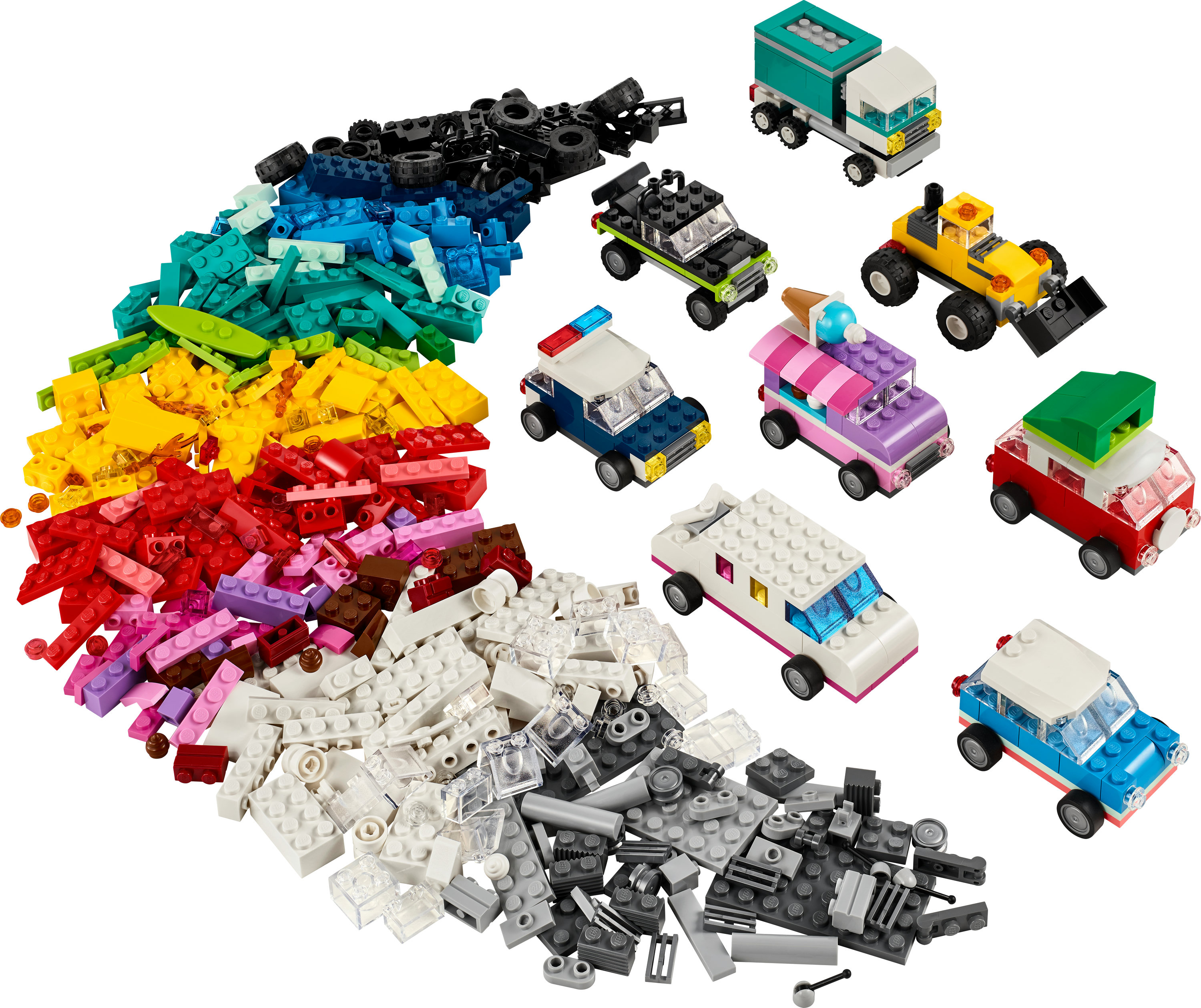 Una collezione di set di veicoli Lego City e mattoncini Lego è in mostra.