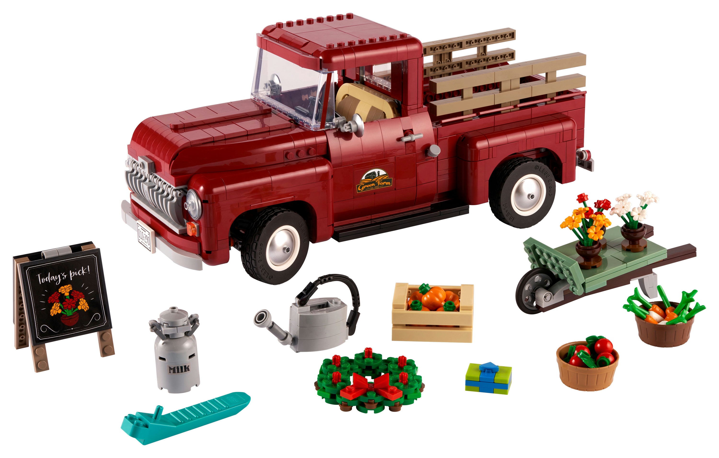 Set Lego: Pickup rosso con fiori, verdure e un cartello per una fattoria.