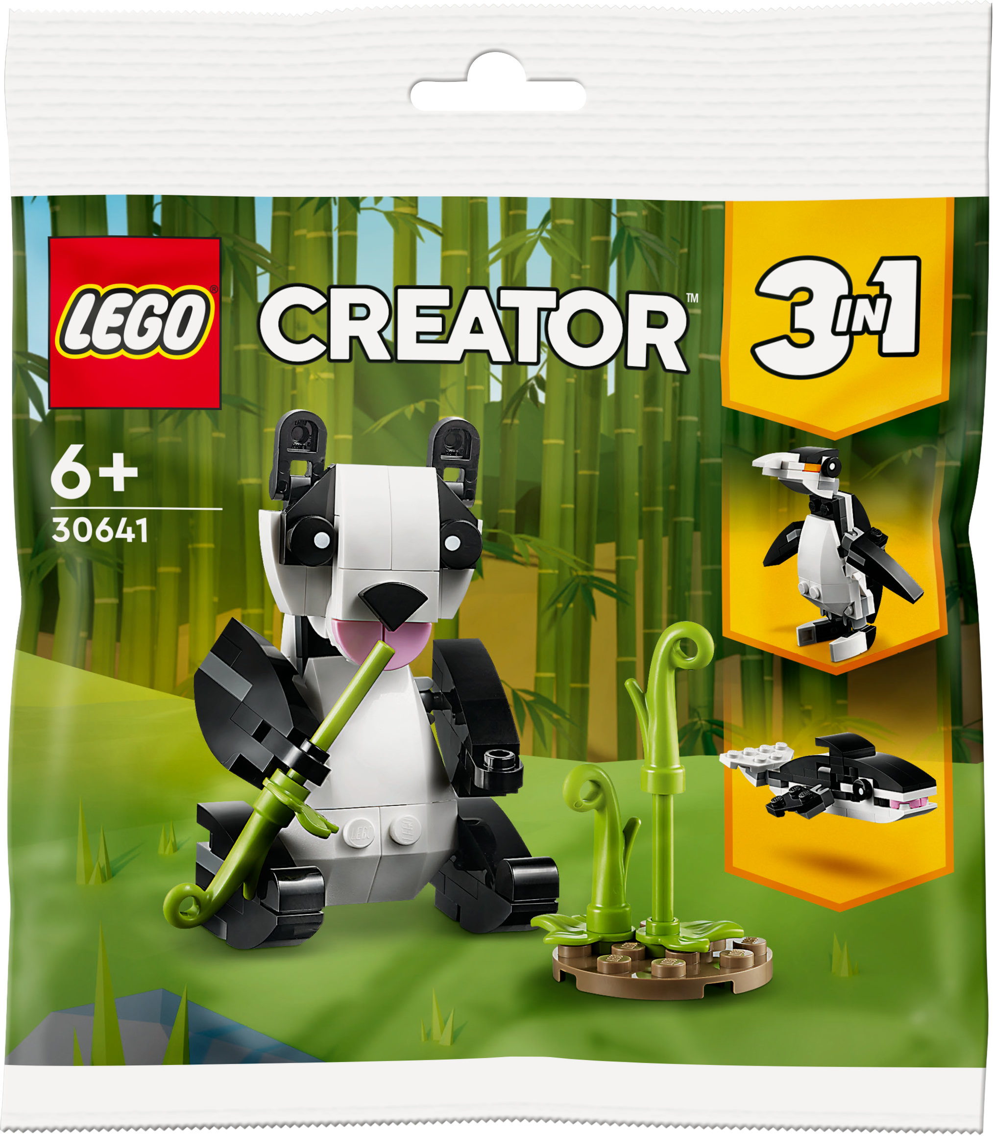 Ein Lego Creator Panda-Spielzeug in einer Verpackung mit anderen Tieren und Bambushintergrund.