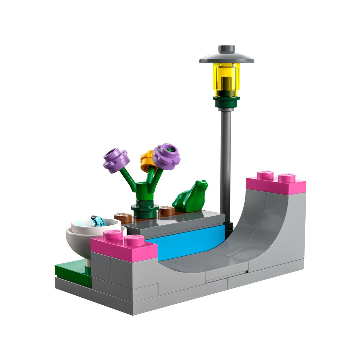 Ensemble LEGO Friends avec une scène de parc, comprenant une lampe, des fleurs et une rampe de skate.