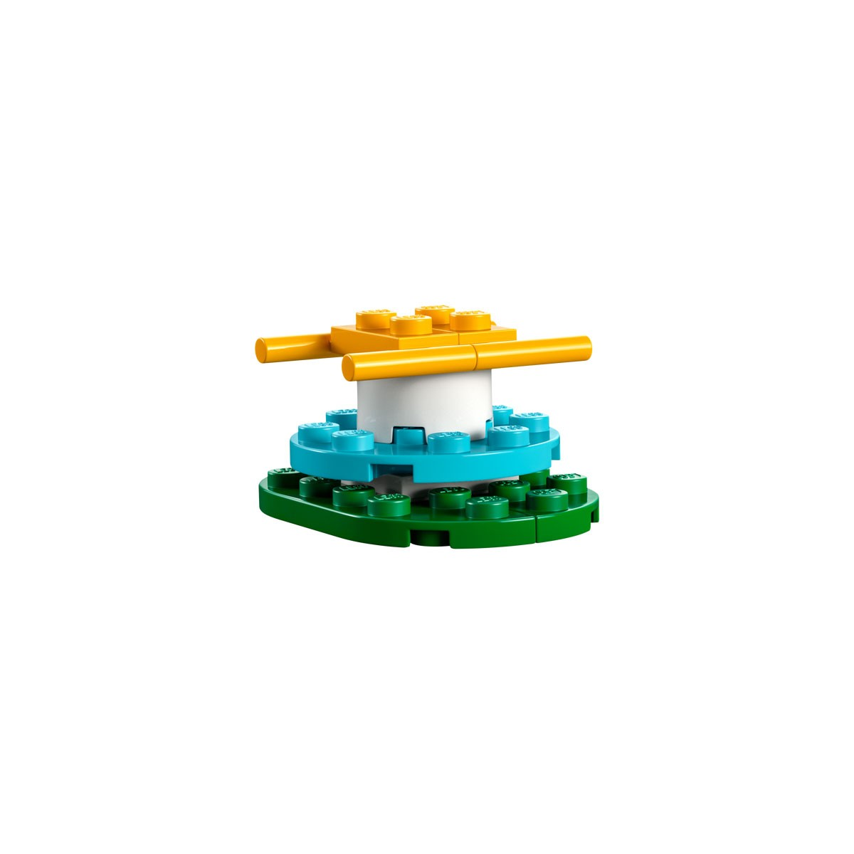 Une petite construction Lego avec des briques jaunes, bleues et vertes, ressemblant à une petite structure.