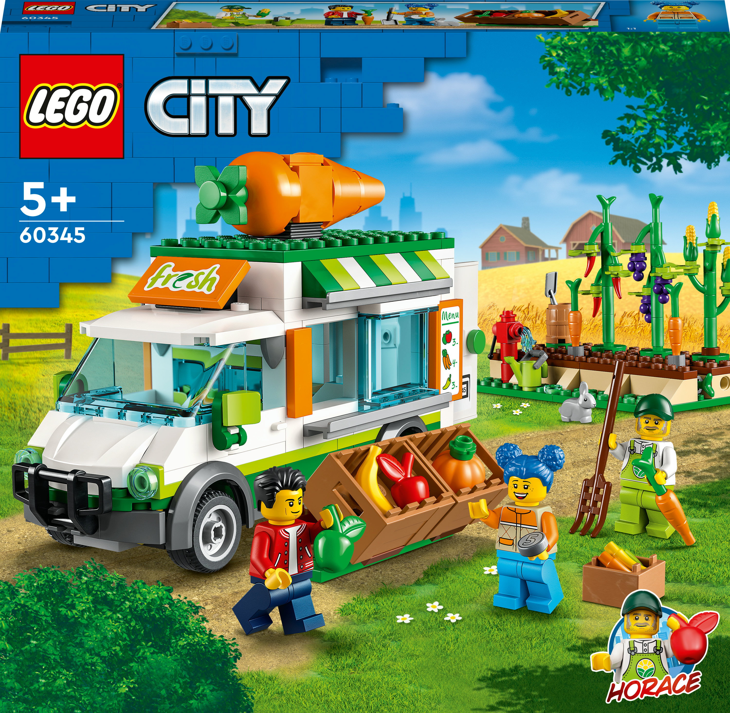 Zestaw Lego City z food truckiem, figurkami i tłem farmy z uprawami i wiatrakiem.