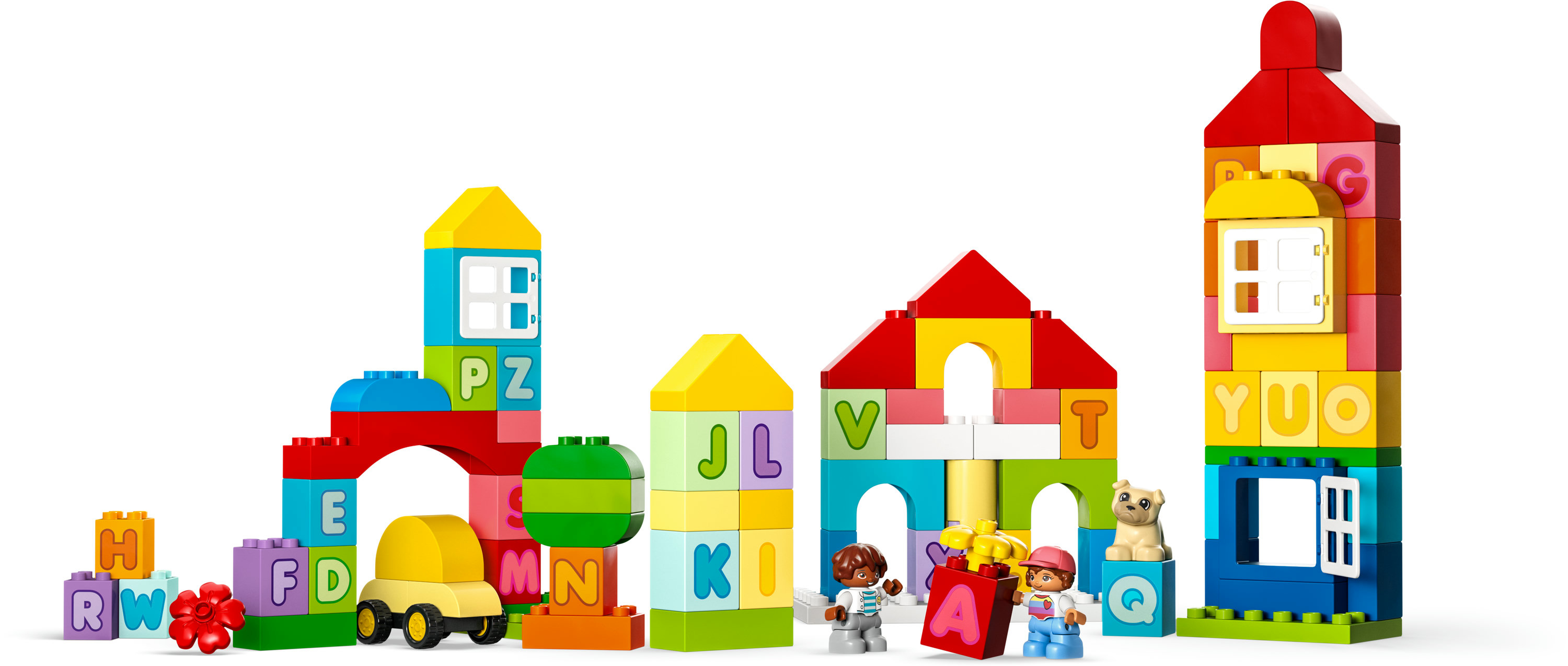 Set di mattoncini Lego Duplo con vari blocchi colorati che formano edifici, un'auto e figure.