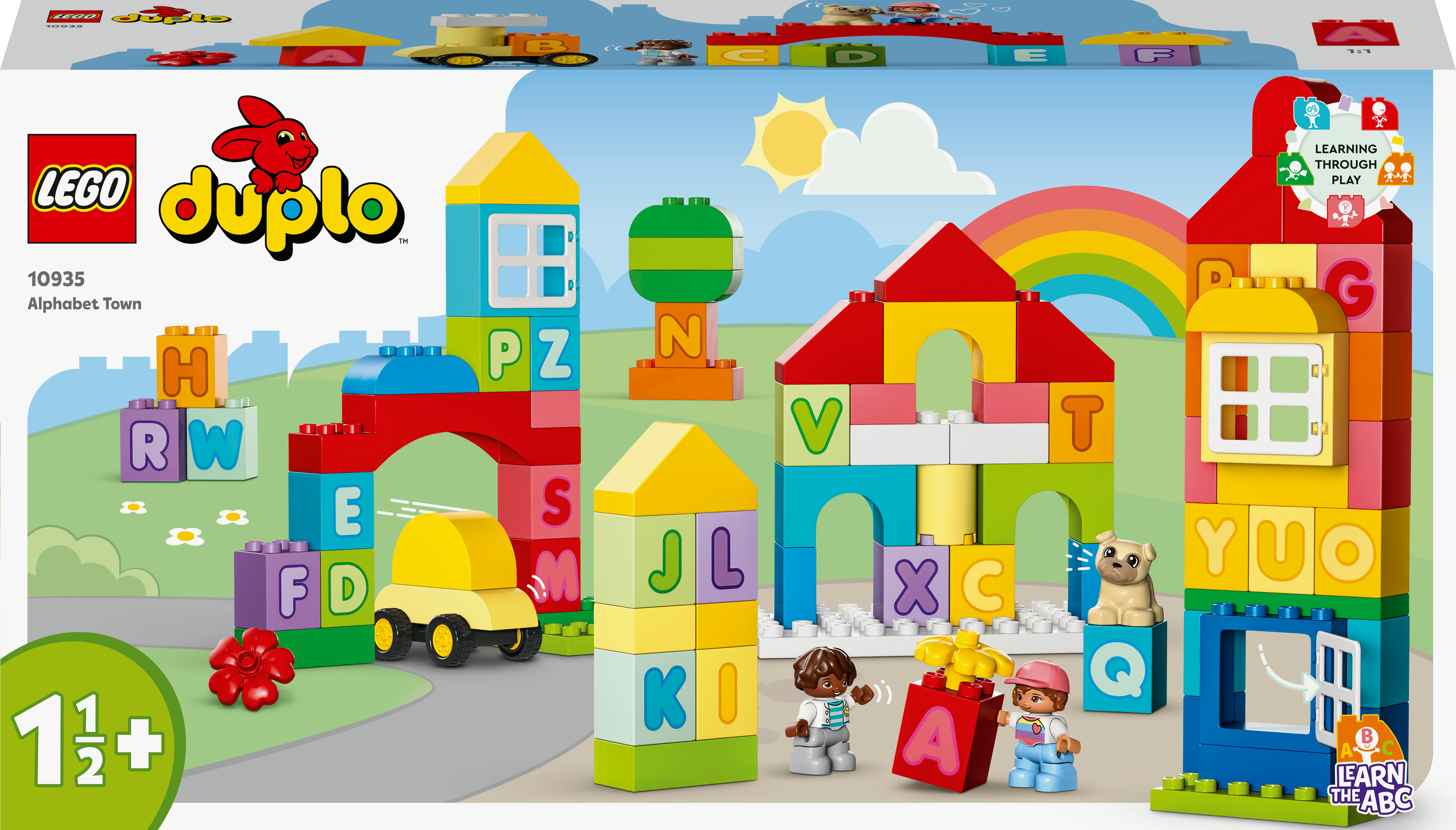 Set Lego Duplo con edifici colorati, lettere, auto e personaggi, promuove l'apprendimento attraverso il gioco.