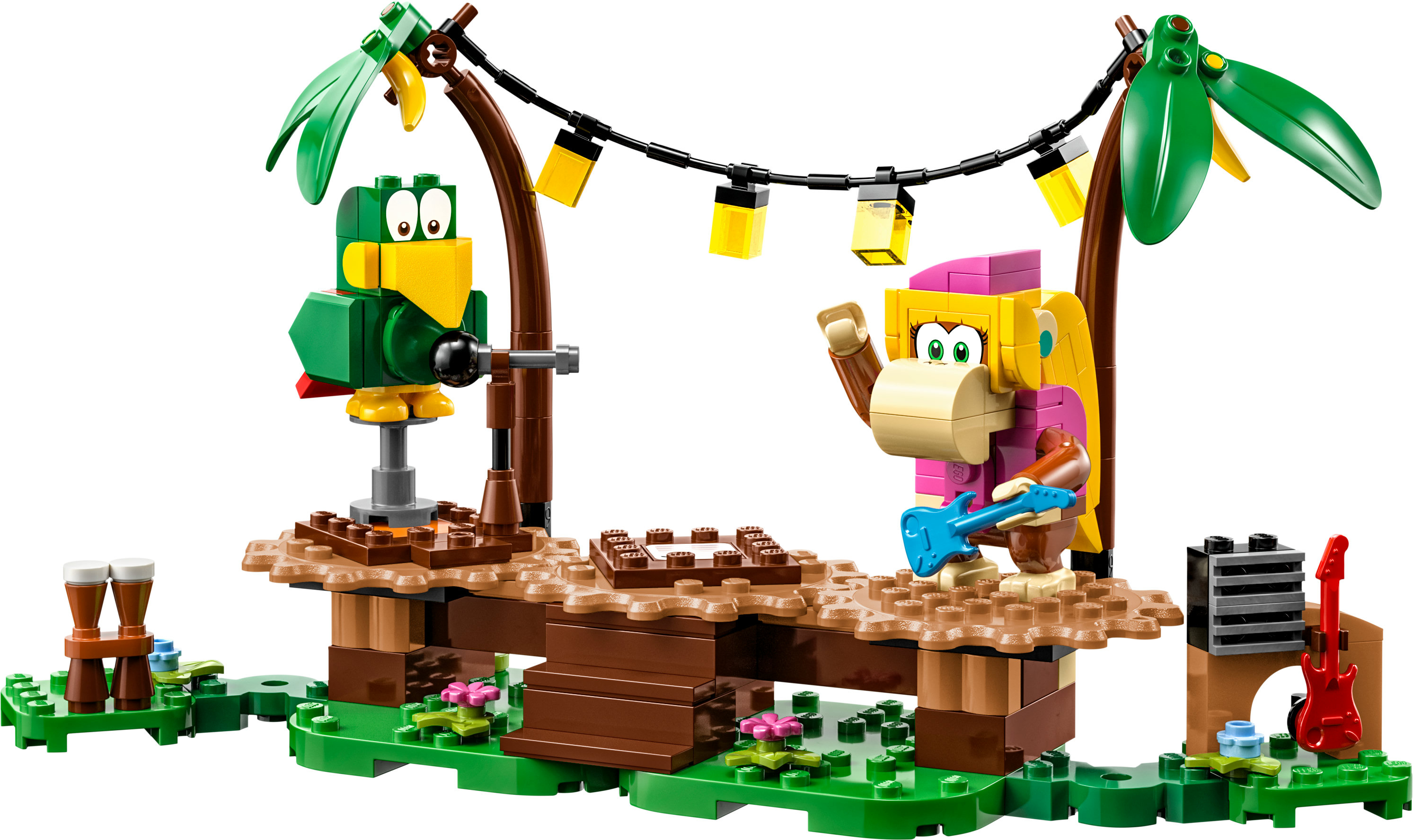 Een Lego-set met twee apen, een papegaai en een gitaar op een podium met lichten en een drumstel.