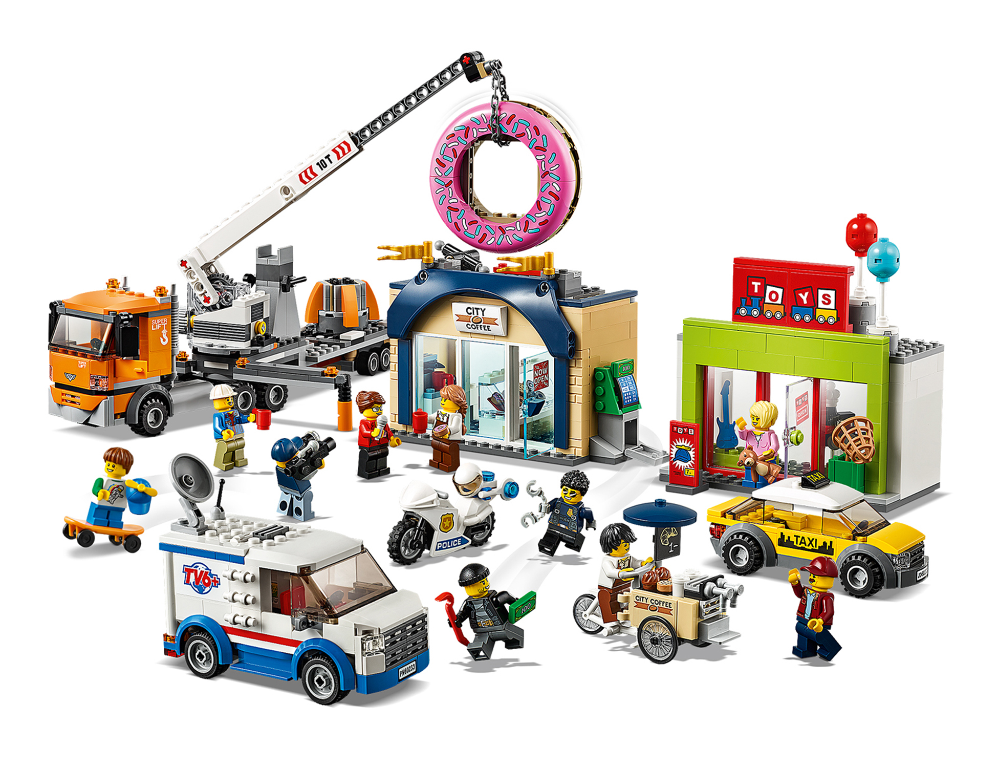 Set Lego City: edifici, autogru, negozio di ciambelle e molte minifigure.