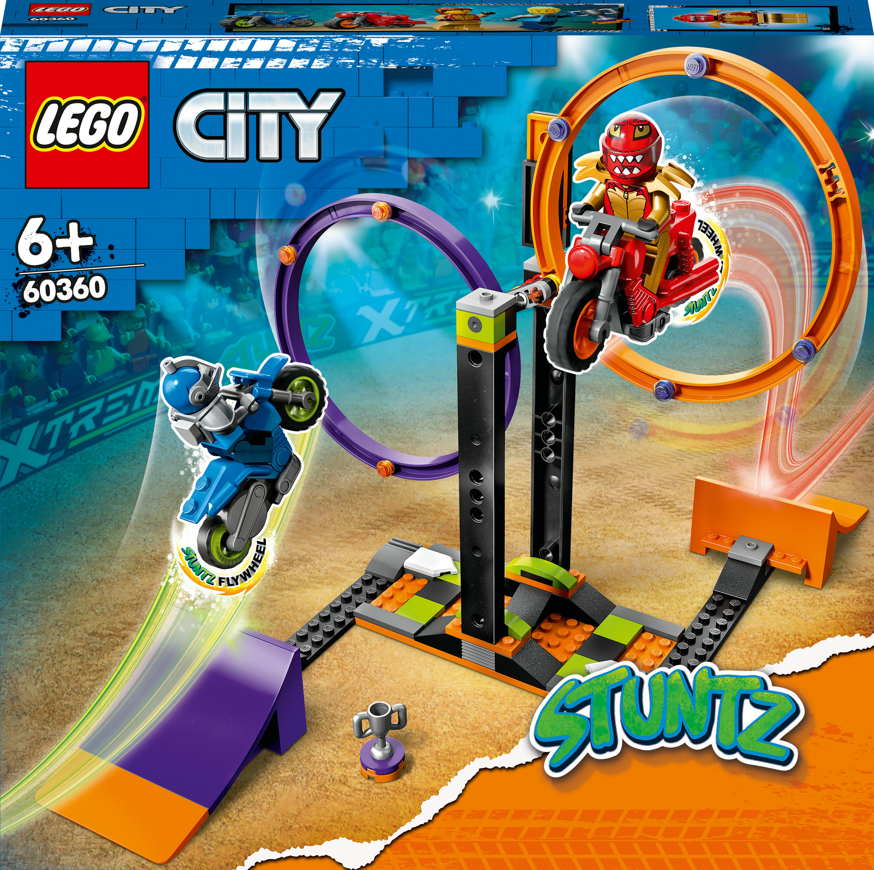 Una caja del set LEGO City Stuntz muestra una moto acrobática, rampas y anillos. Una moto roja hace un truco.