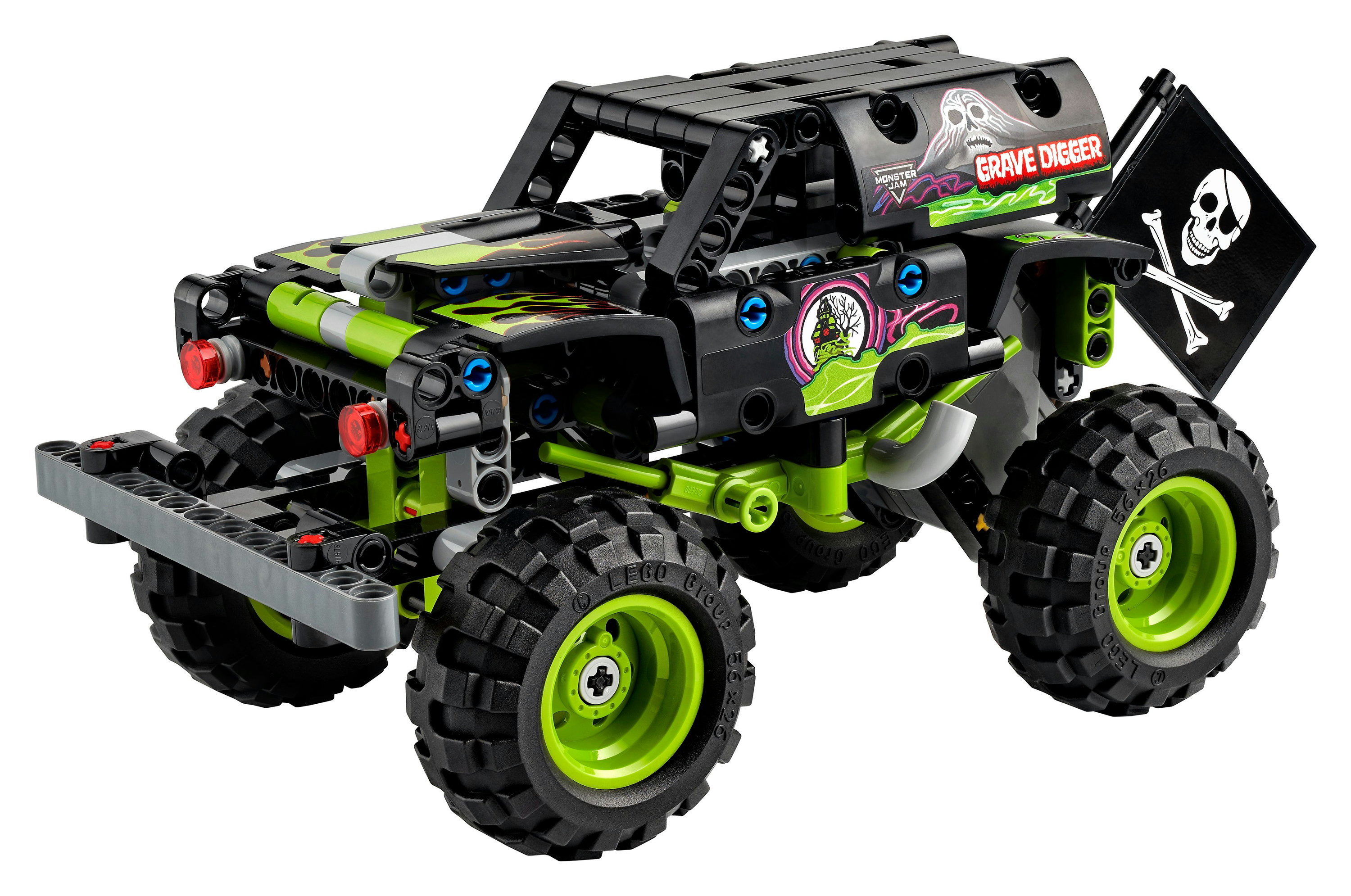 Bir Lego Technic Grave Digger canavar kamyonu siyah ve yeşildir, büyük tekerlekleri ve bir kafatası bayrağı vardır.