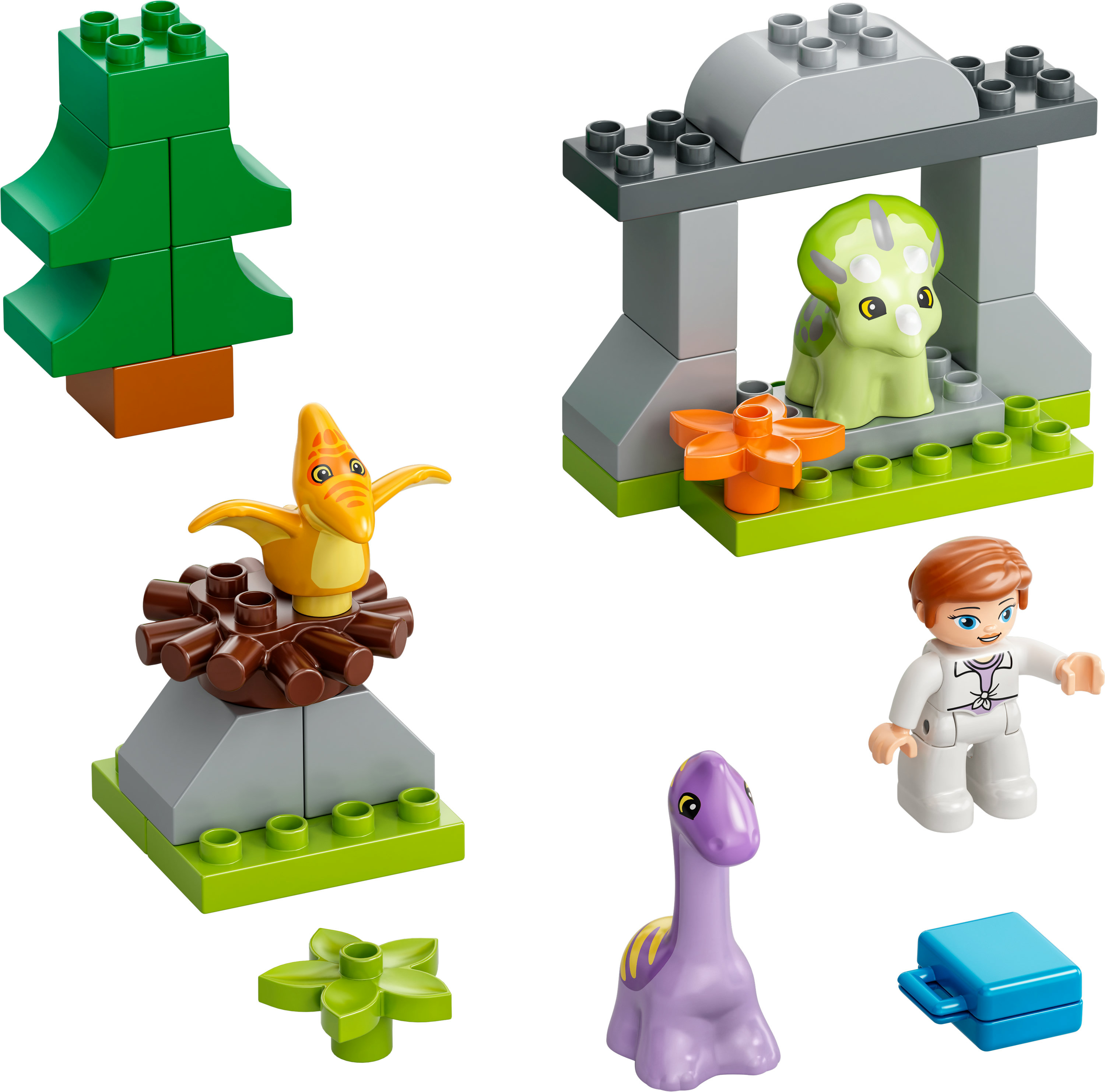 Lego Duplo Set: Dinosaurier, ein Baum und eine Kinderfigur in einer grün-grauen Umgebung.
