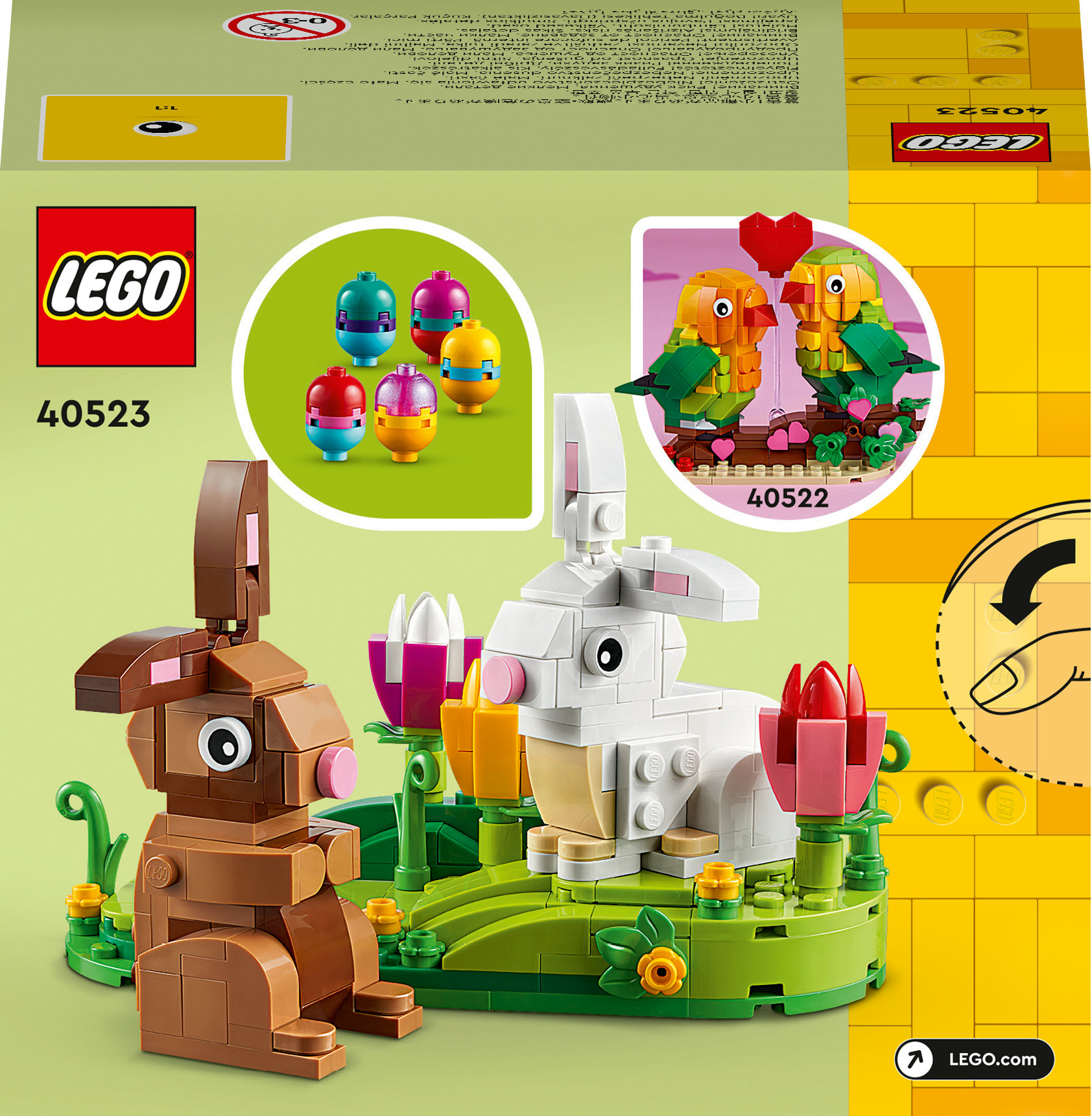 LEGO set kutusu, tavşan ve kuş modelleri ile birlikte, yumurta şeklinde ek modeller, yeşil bir zeminde.