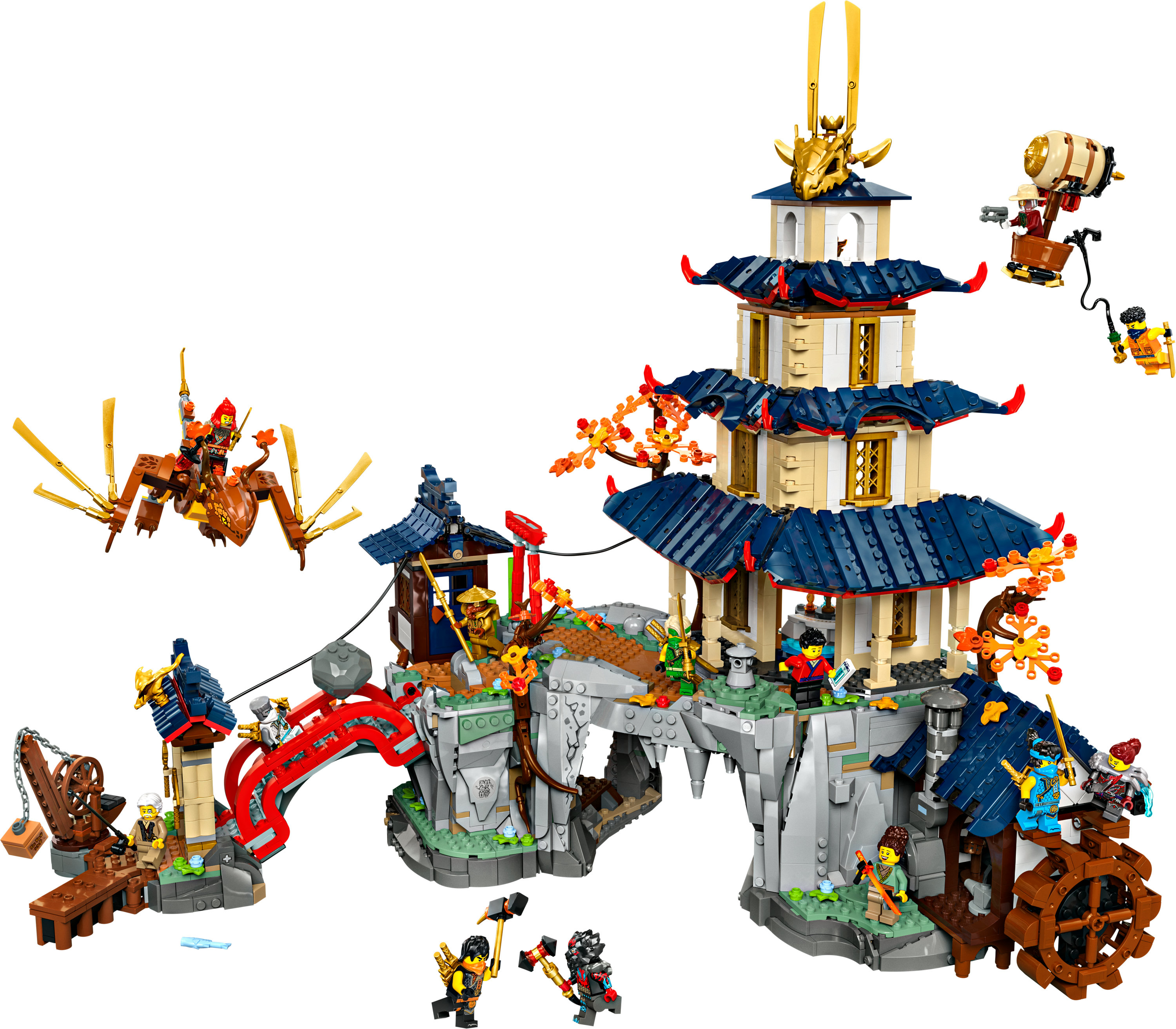 Duży zestaw LEGO Ninjago z wielopoziomową świątynią i różnymi figurkami ninja w akcji.