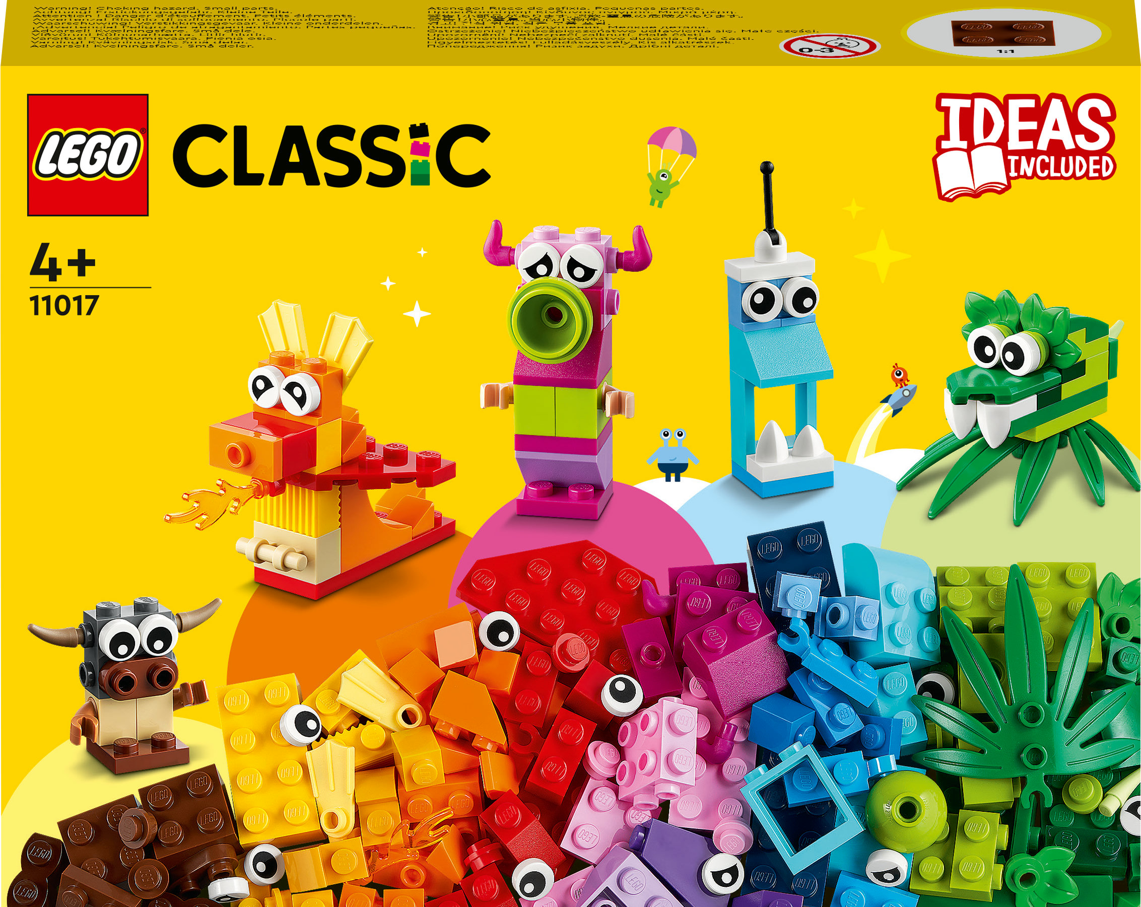 Sarı bir arka plan üzerinde renkli tuğlalar ve çeşitli yapılı yaratıklarla Lego Classic seti.