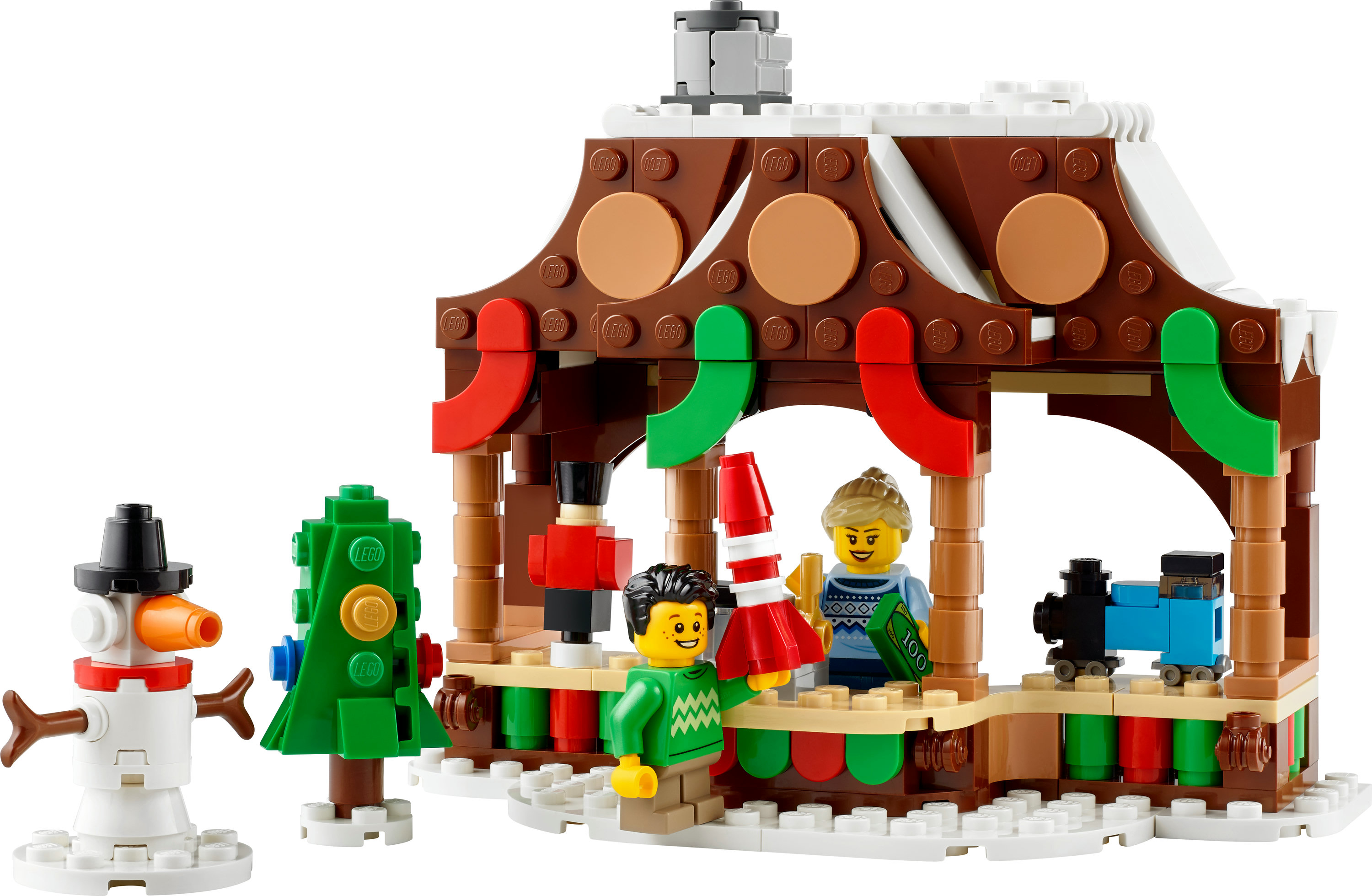 Zestaw Lego Winter Village: scena jarmarku bożonarodzeniowego z figurkami, bałwanem i choinką.