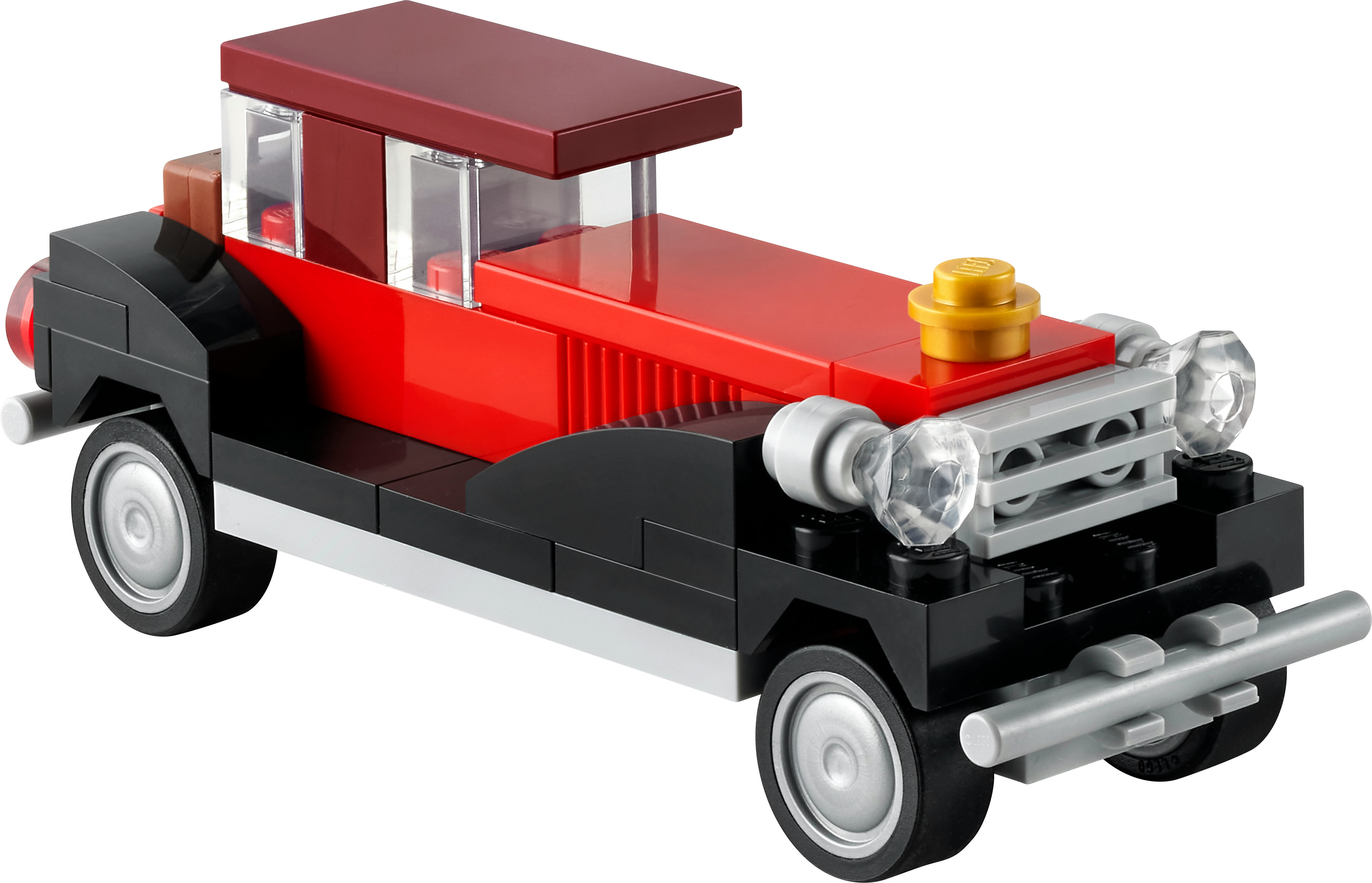 Kırmızı çatılı ve üzerinde altın detaylı siyah bir Lego araba, beyaz bir zemine karşı.
