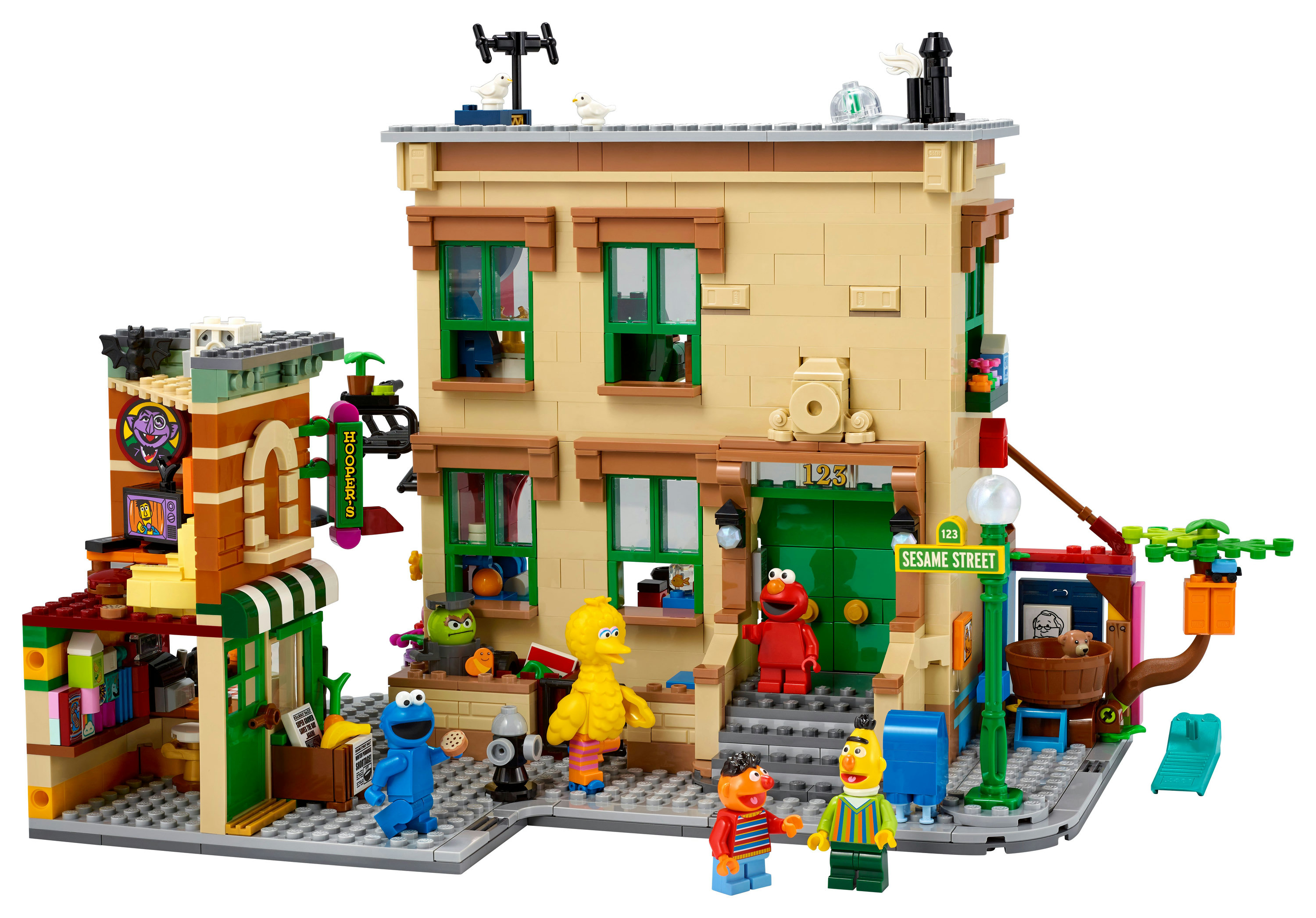 Un set Lego raffigura Sesame Street, con edifici, personaggi come Elmo, Cookie Monster, Big Bird e vetrine.