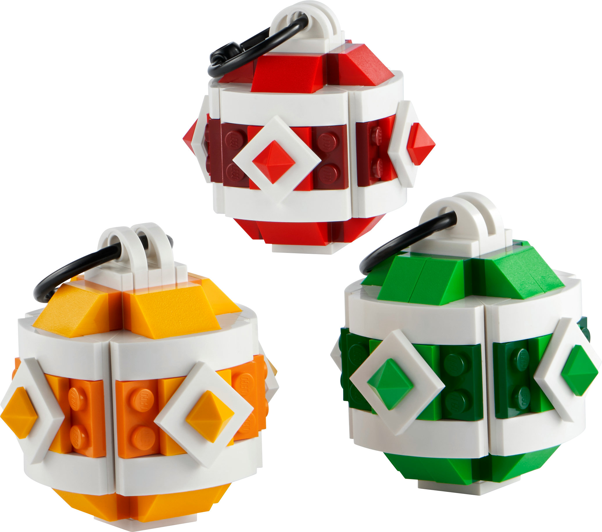 Drei Lego Weihnachtskugeln: rot, grün und gelb mit weißen und orangefarbenen Akzenten.