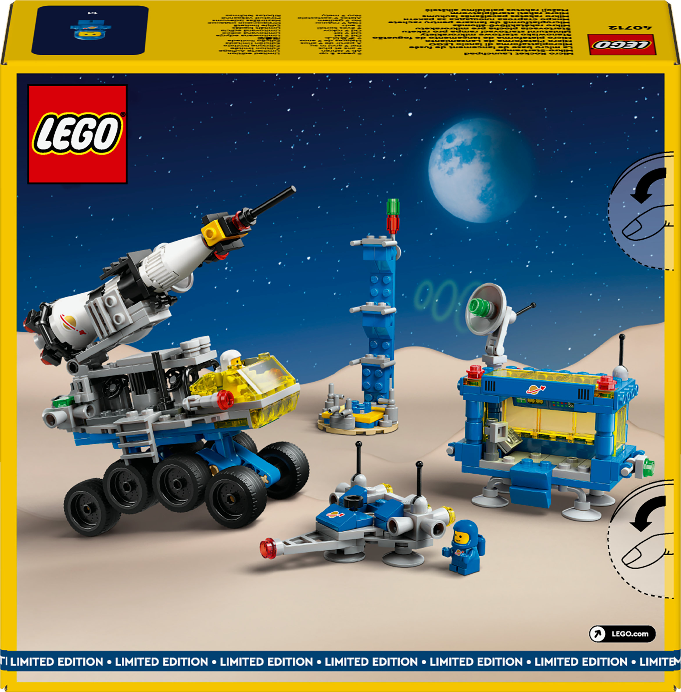 Una scatola Lego raffigura una scena spaziale con un veicolo grande, una torre, un satellite e una luna.