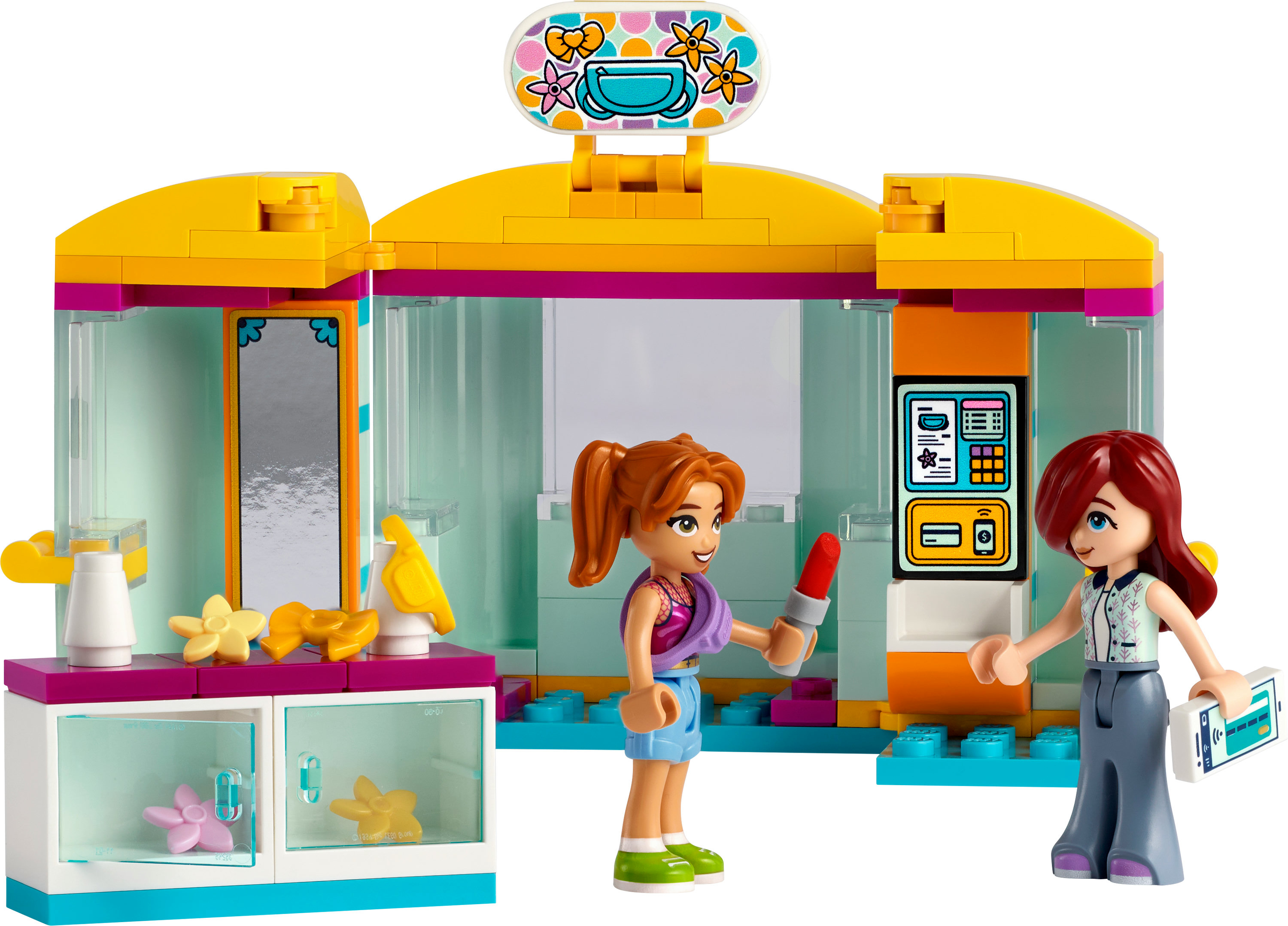 LEGO Friends Set mit zwei Figuren vor einem Geschäft, eine mit Lippenstift, die andere mit Quittung.