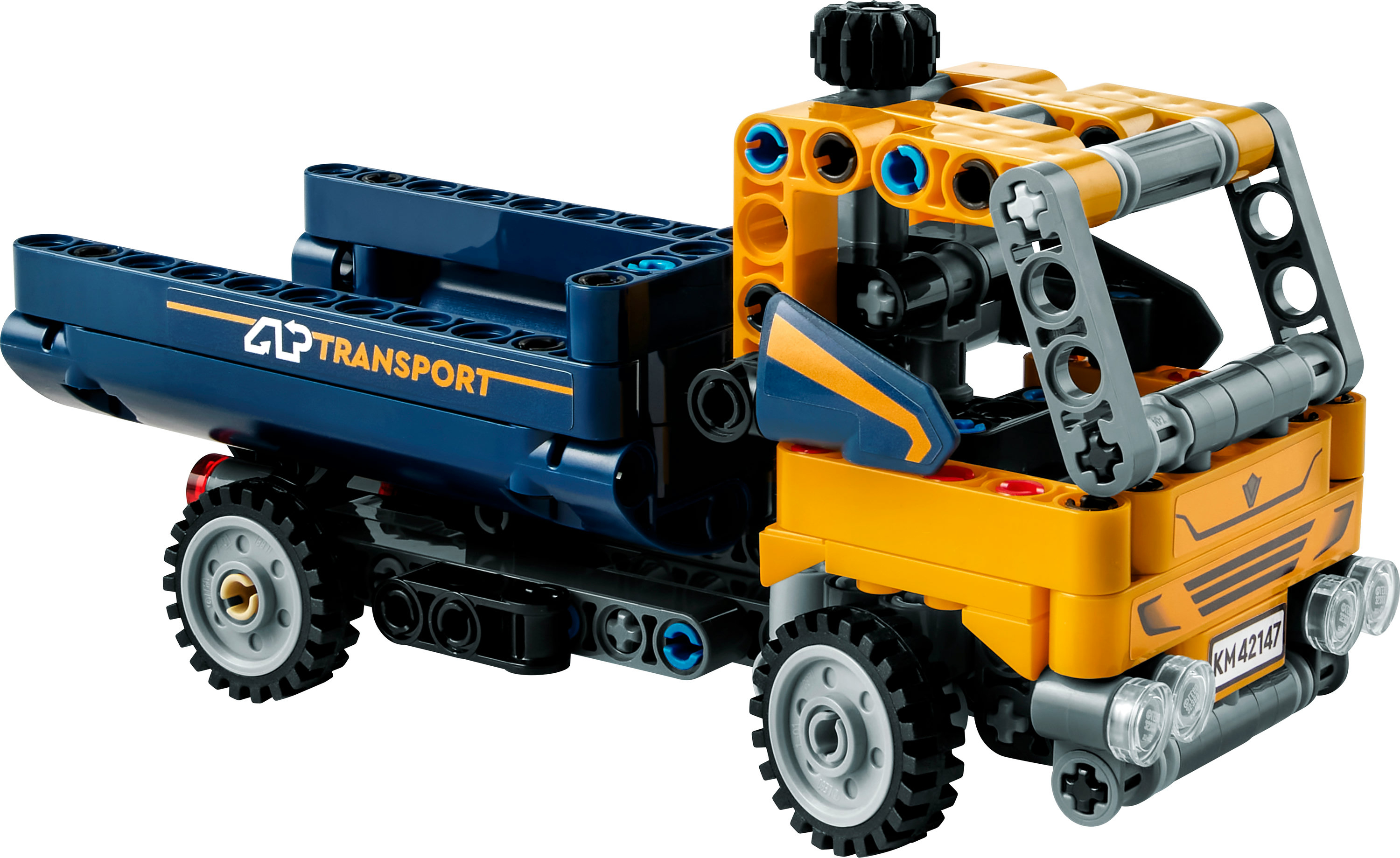 Camión Lego Technic: amarillo y azul, con engranajes visibles y diseño detallado. Aislado sobre blanco.