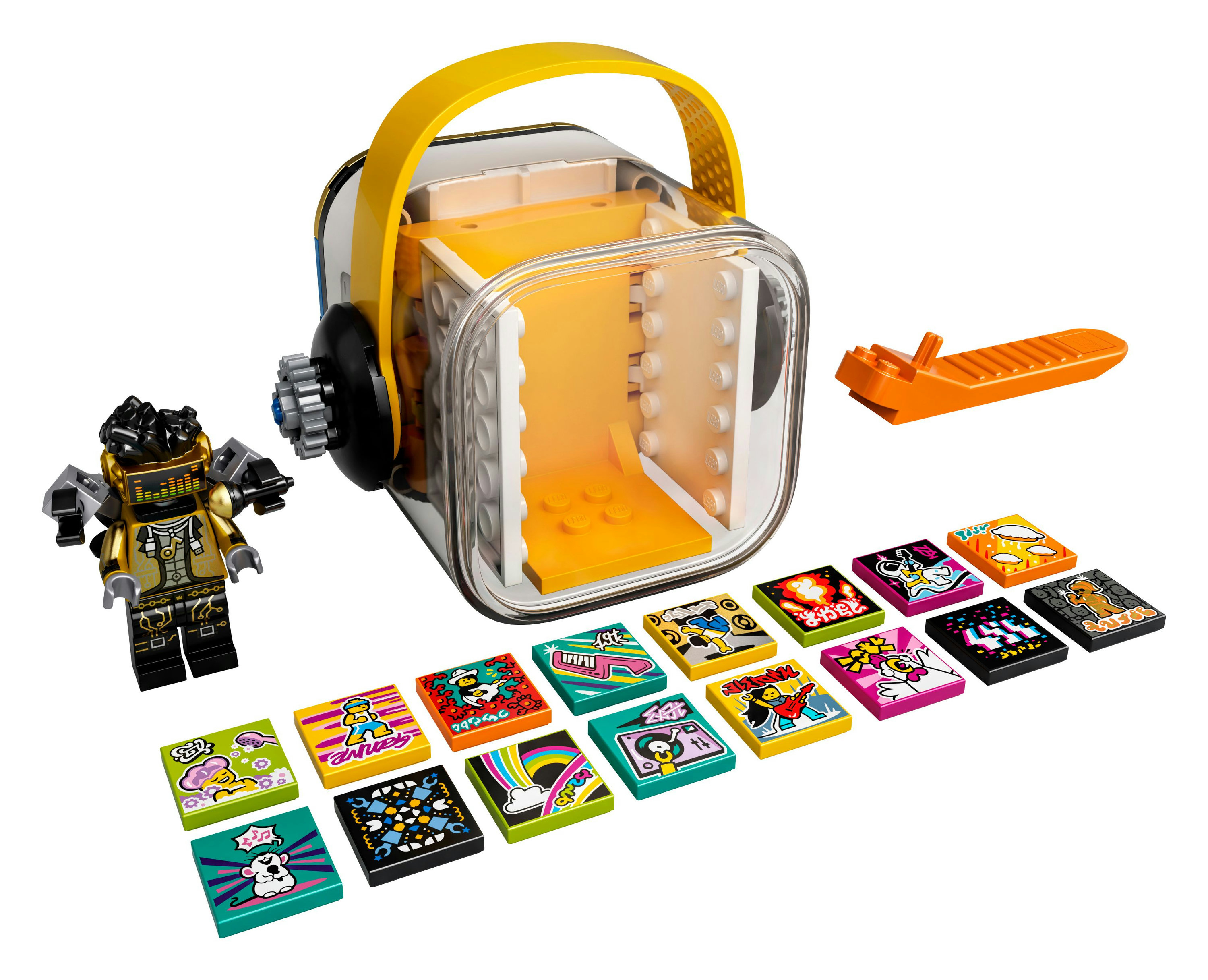 Lego-Set mit klarer Box, Minifigur und bunten bedruckten Kacheln mit Musikthemen.