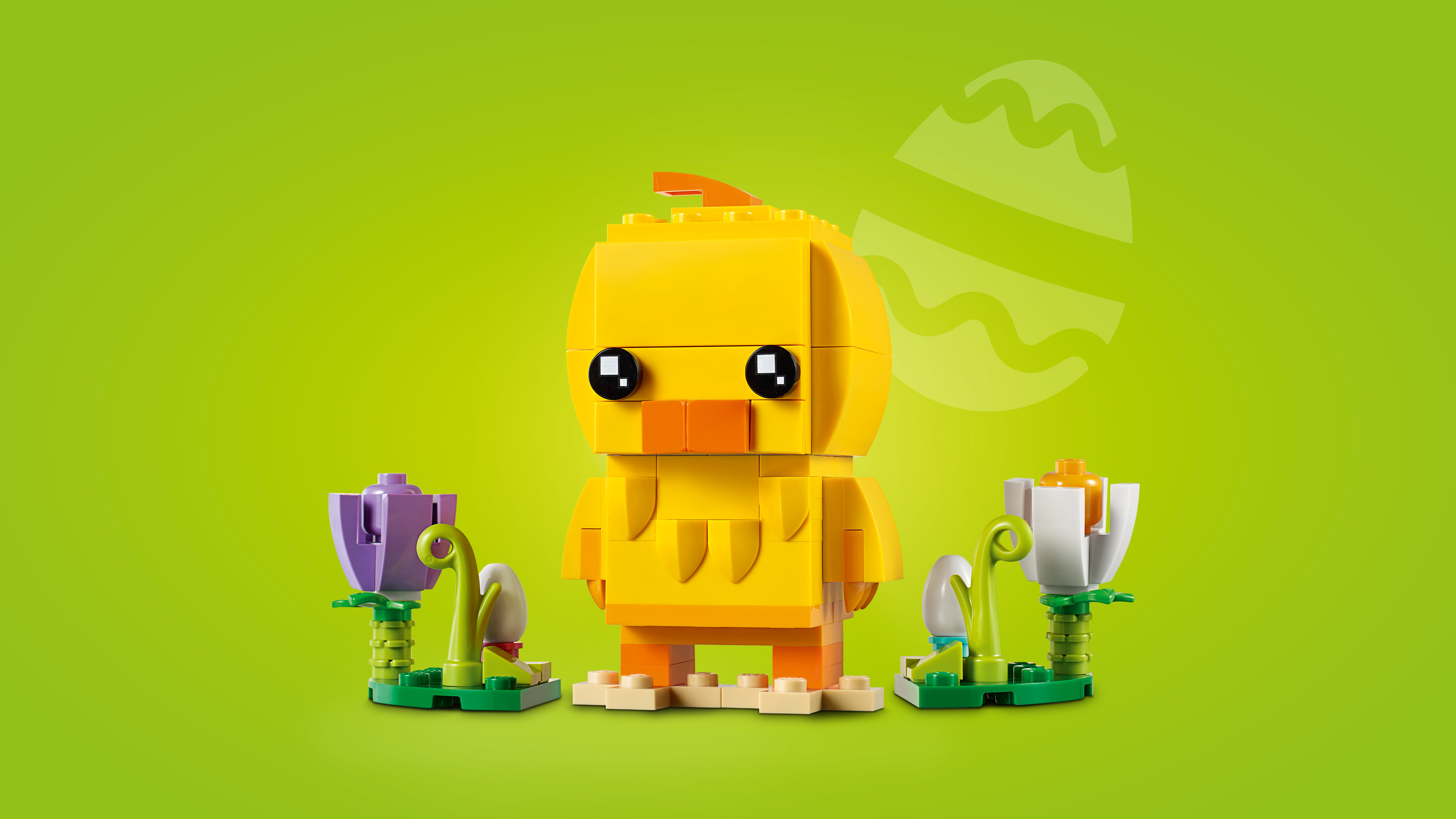 Lego Osterküken: Ein gelbes Küken mit Blumen vor grünem Hintergrund.