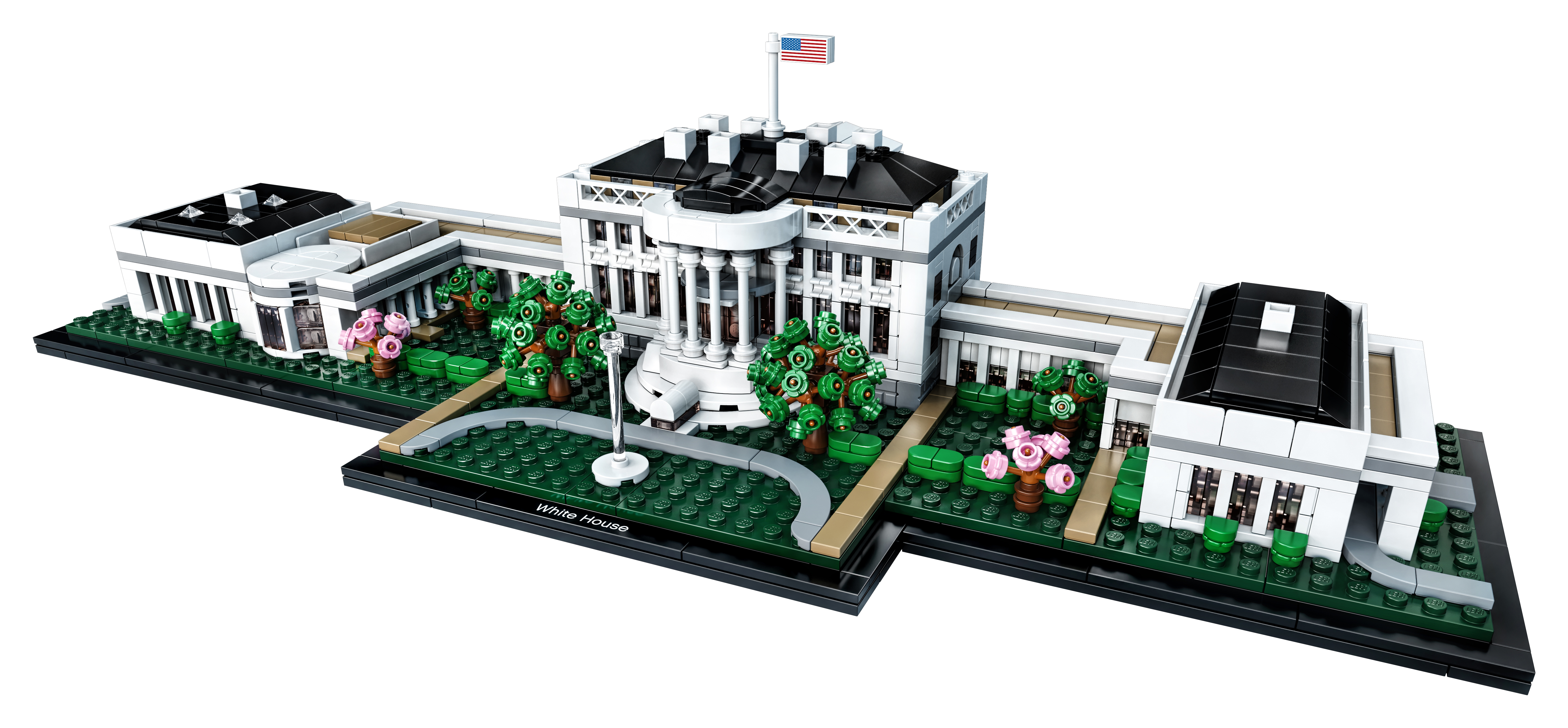 Model Lego Białego Domu przedstawia fasadę budynku, drzewa i flagę USA na czarnej podstawie.